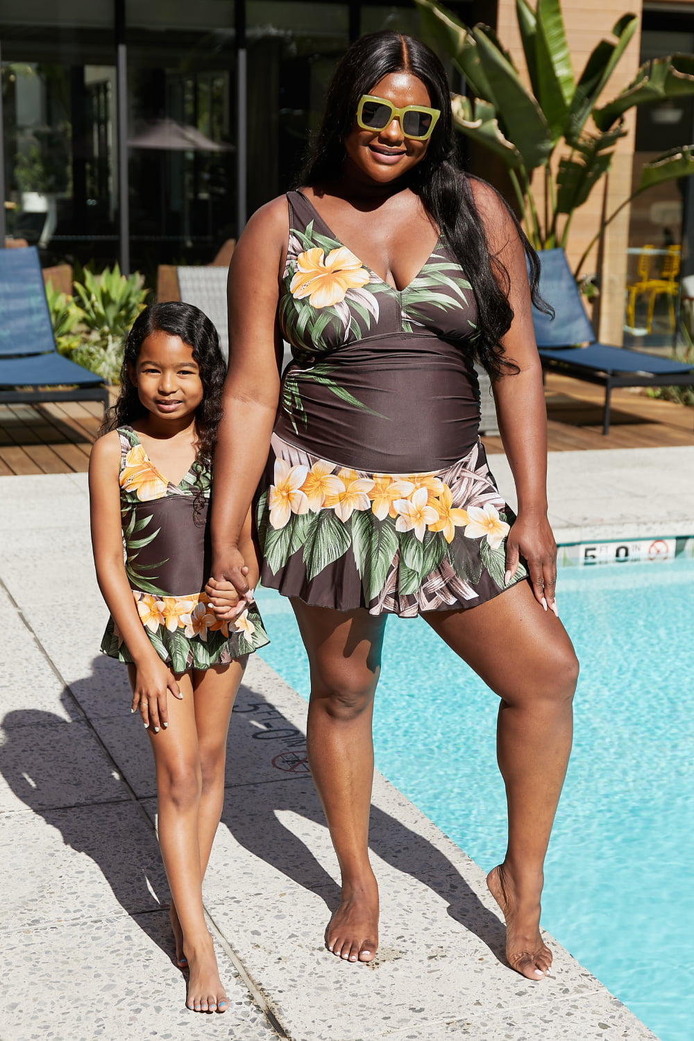 Marina West Swim Clear Waters Swim Dress in Aloha Brown featuring a floral pattern and built-in boyshorts, perfect for feminine swim days.