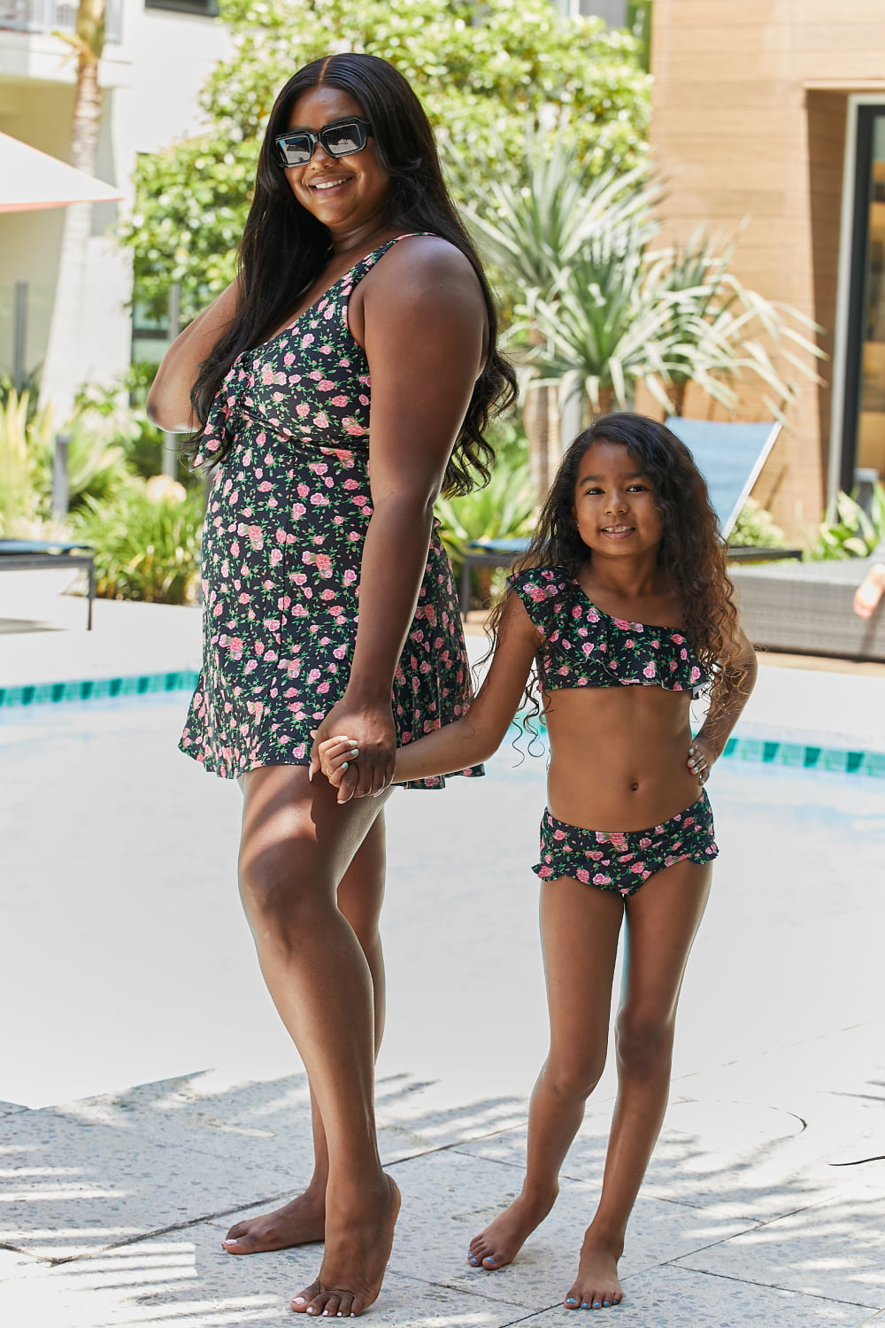 Marina West Swim Clear Waters Two-Piece Swim Set featuring a floral pattern in black roses, ruffled design, and asymmetrical neckline.