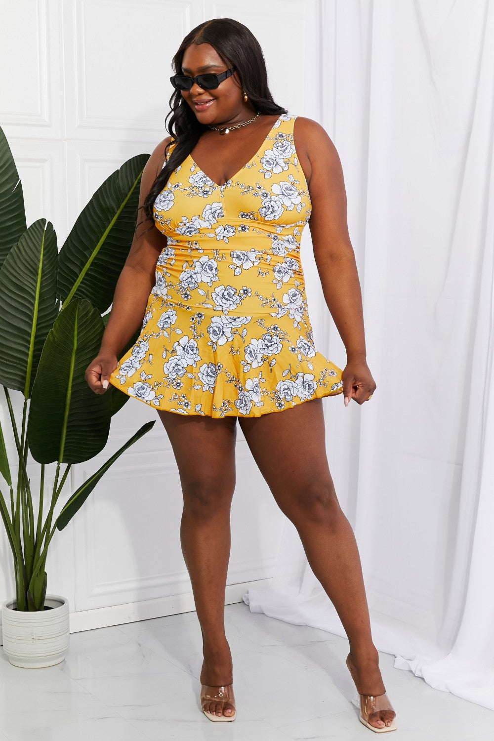 Marina West Swim Full Size Clear Waters Swim Dress in Mustard featuring a floral pattern and built-in boyshorts, perfect for feminine swim days.