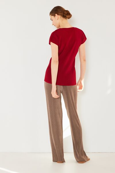 Marina West Swim Rib Pleated Elastic-Waist Wide Leg Pants showcasing ribbed texture and pleats in a stylish design.