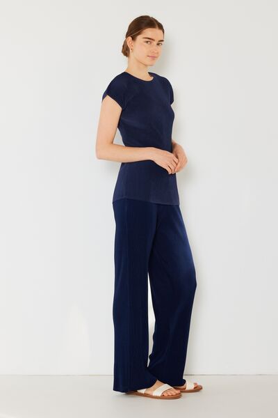 Marina West Swim Rib Pleated Elastic-Waist Wide Leg Pants showcasing ribbed texture and pleats in a stylish design.