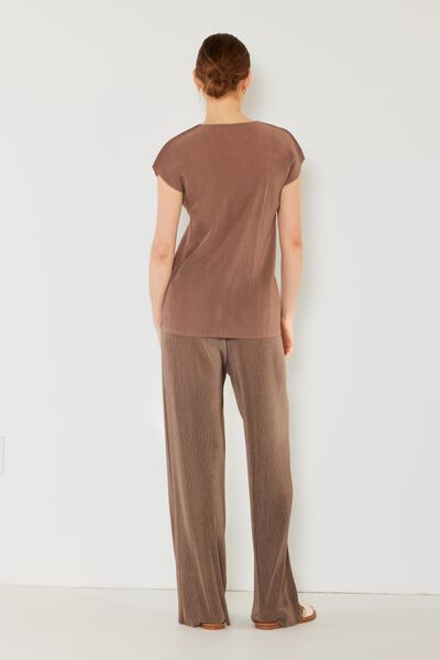 Marina West Swim Rib Pleated Elastic-Waist Wide Leg Pants showcasing ribbed texture and pleats in a stylish design.