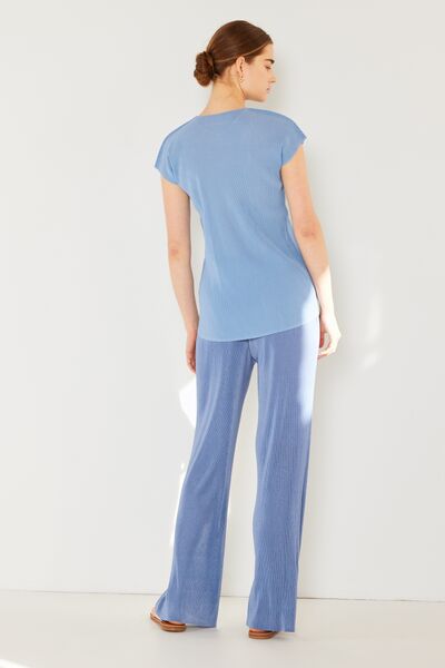 Marina West Swim Rib Pleated Elastic-Waist Wide Leg Pants showcasing ribbed texture and pleats in a stylish design.