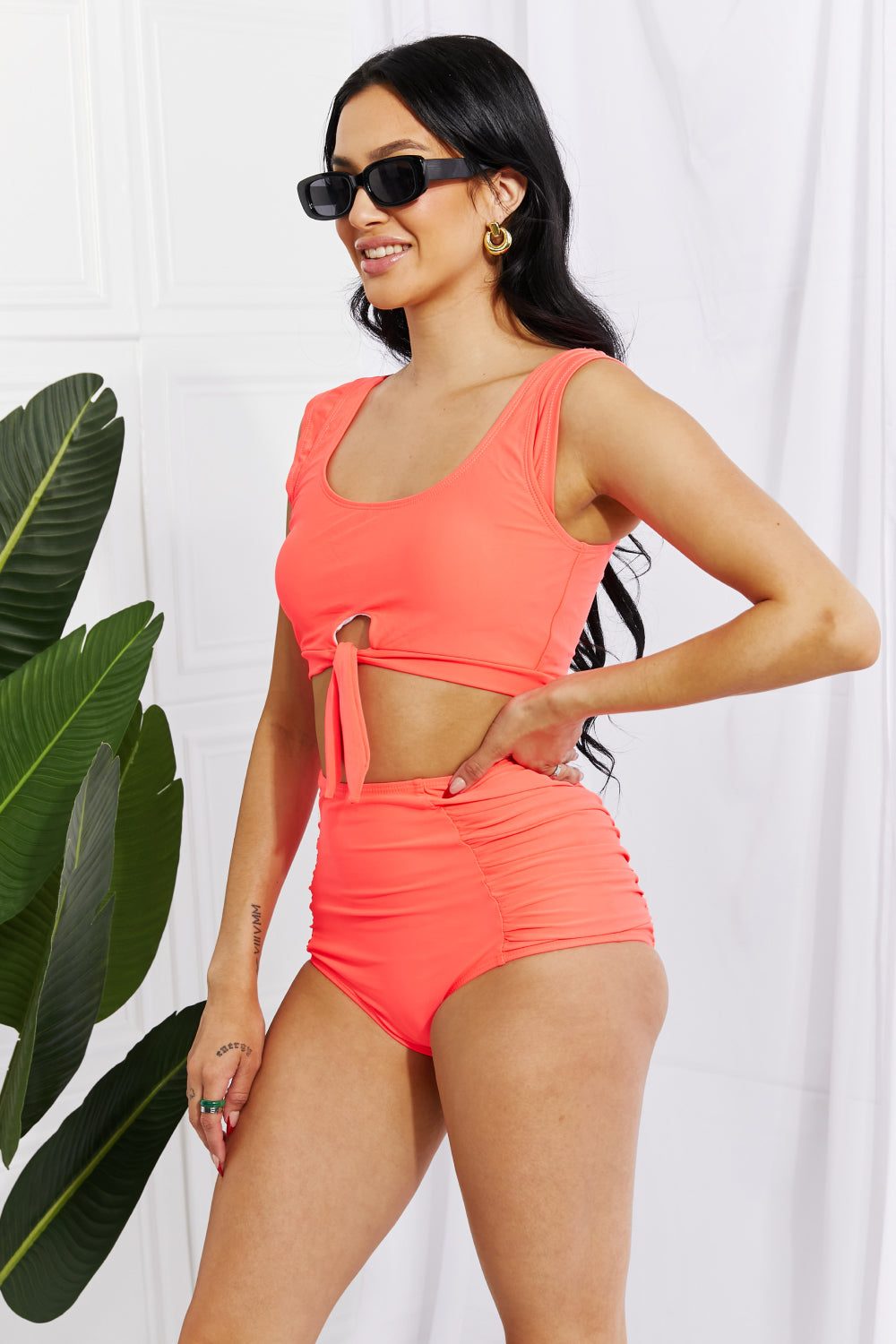 Marina West Swim Sanibel Crop Swim Top and Ruched Bottoms Set in Coral, featuring thick straps and a retro tie detail.