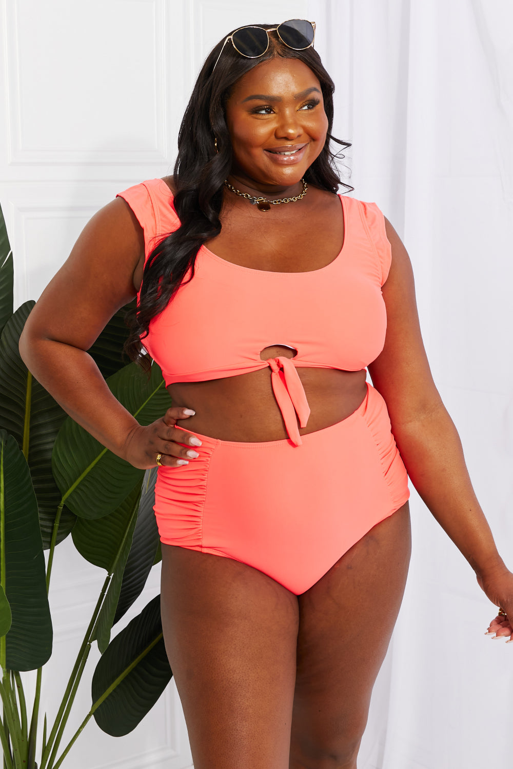 Marina West Swim Sanibel Crop Swim Top and Ruched Bottoms Set in Coral, featuring thick straps and a retro tie detail.