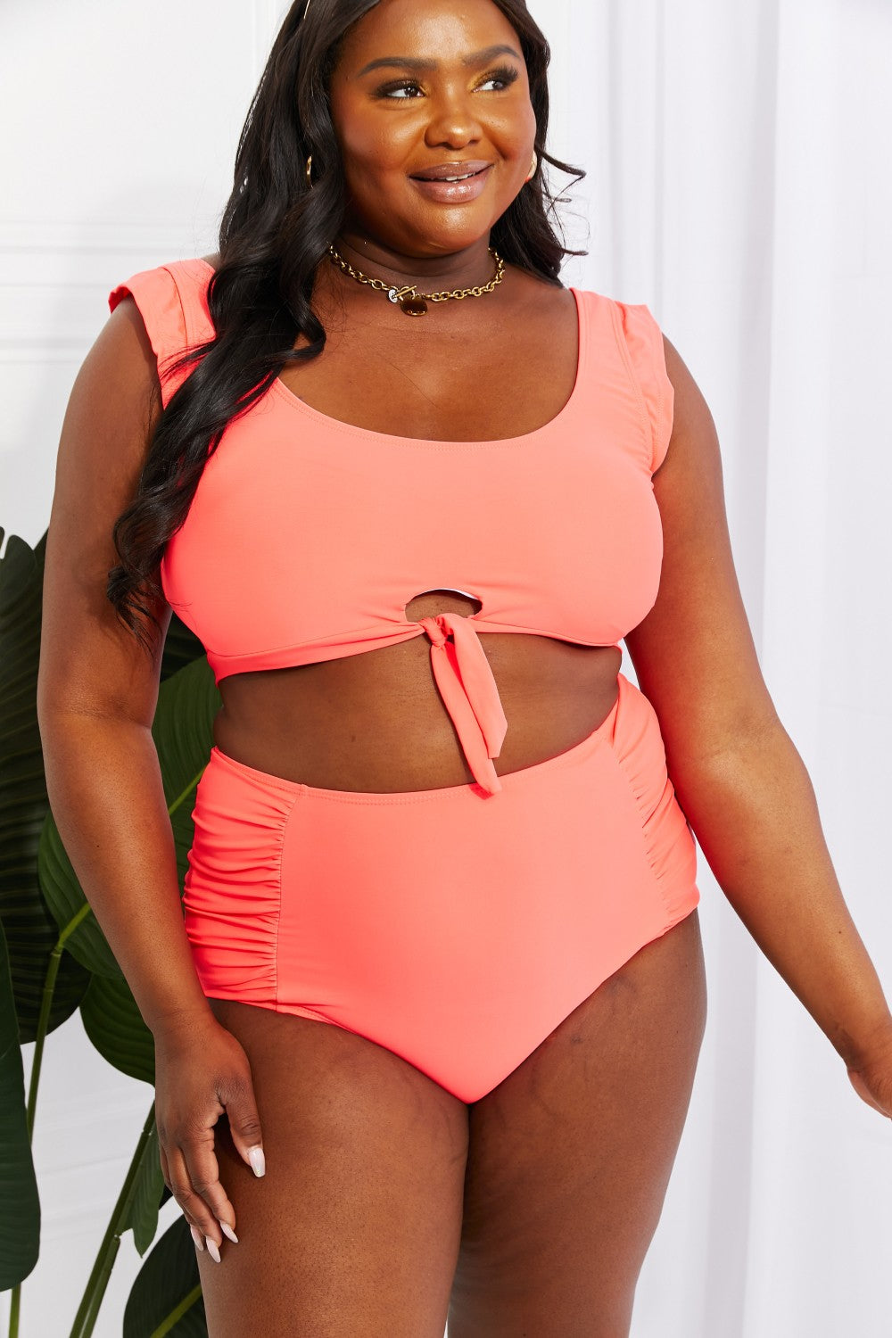 Marina West Swim Sanibel Crop Swim Top and Ruched Bottoms Set in Coral, featuring thick straps and a retro tie detail.