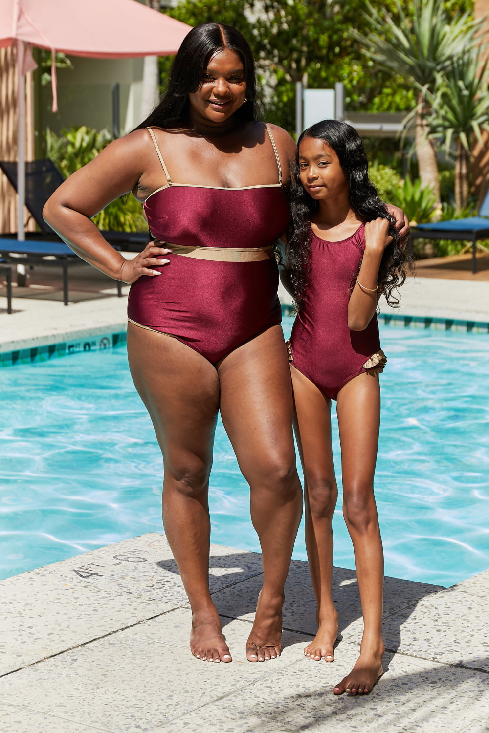 Marina West Swim Wave Break One-Piece in Wine with contrast trim, showcasing stylish design and comfortable fit.