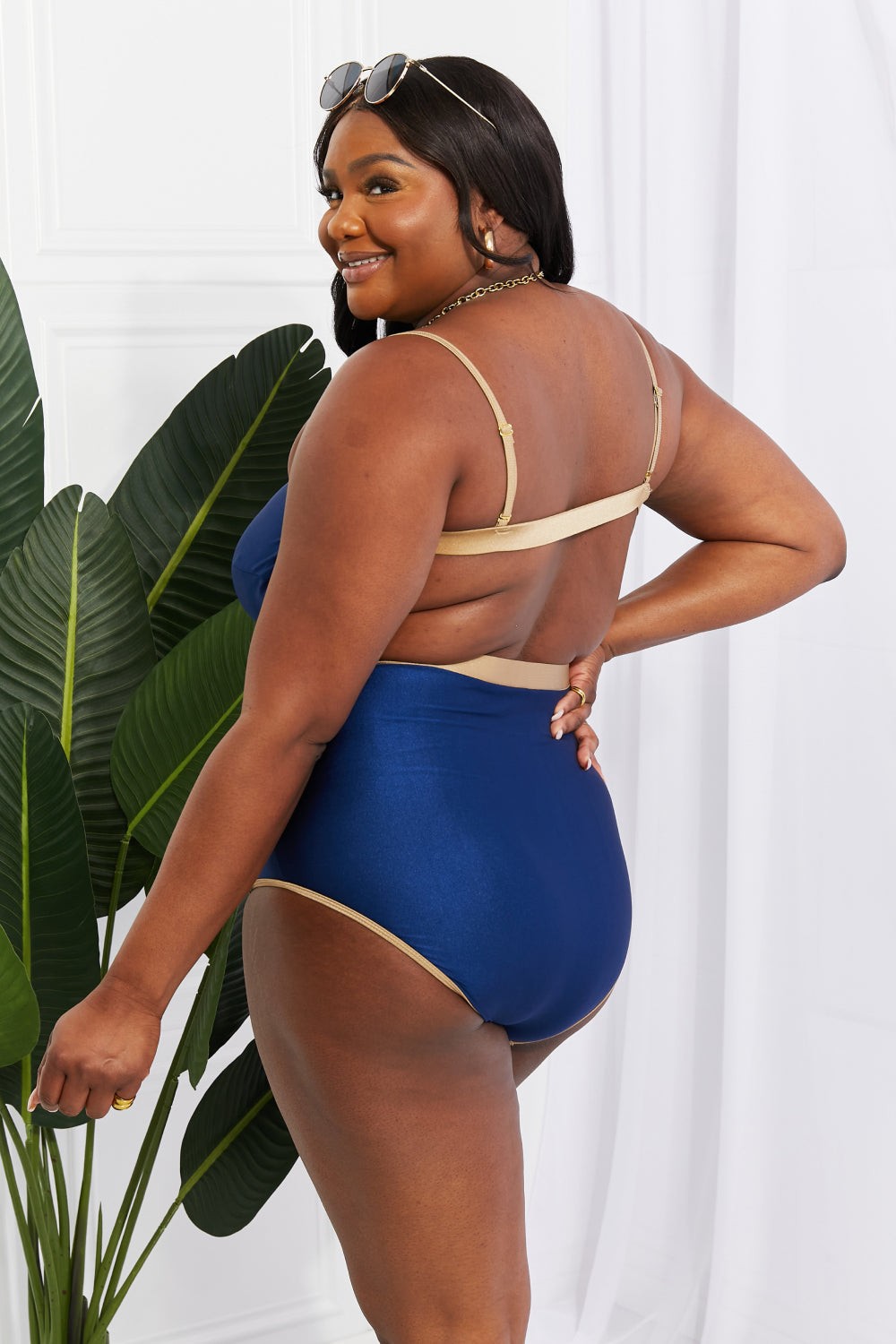 Marina West Swim Wave Break One-Piece swimsuit with contrast trim and open-back detail, showcasing a stylish design perfect for swimming.