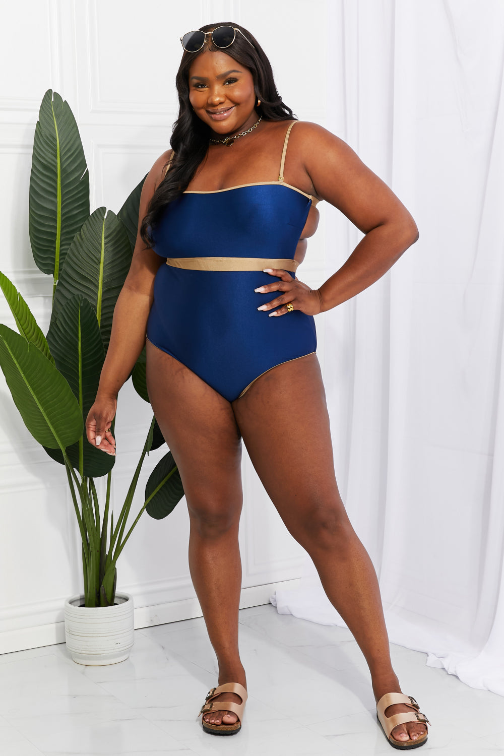 Marina West Swim Wave Break One-Piece swimsuit with contrast trim and open-back detail, showcasing a stylish design perfect for swimming.