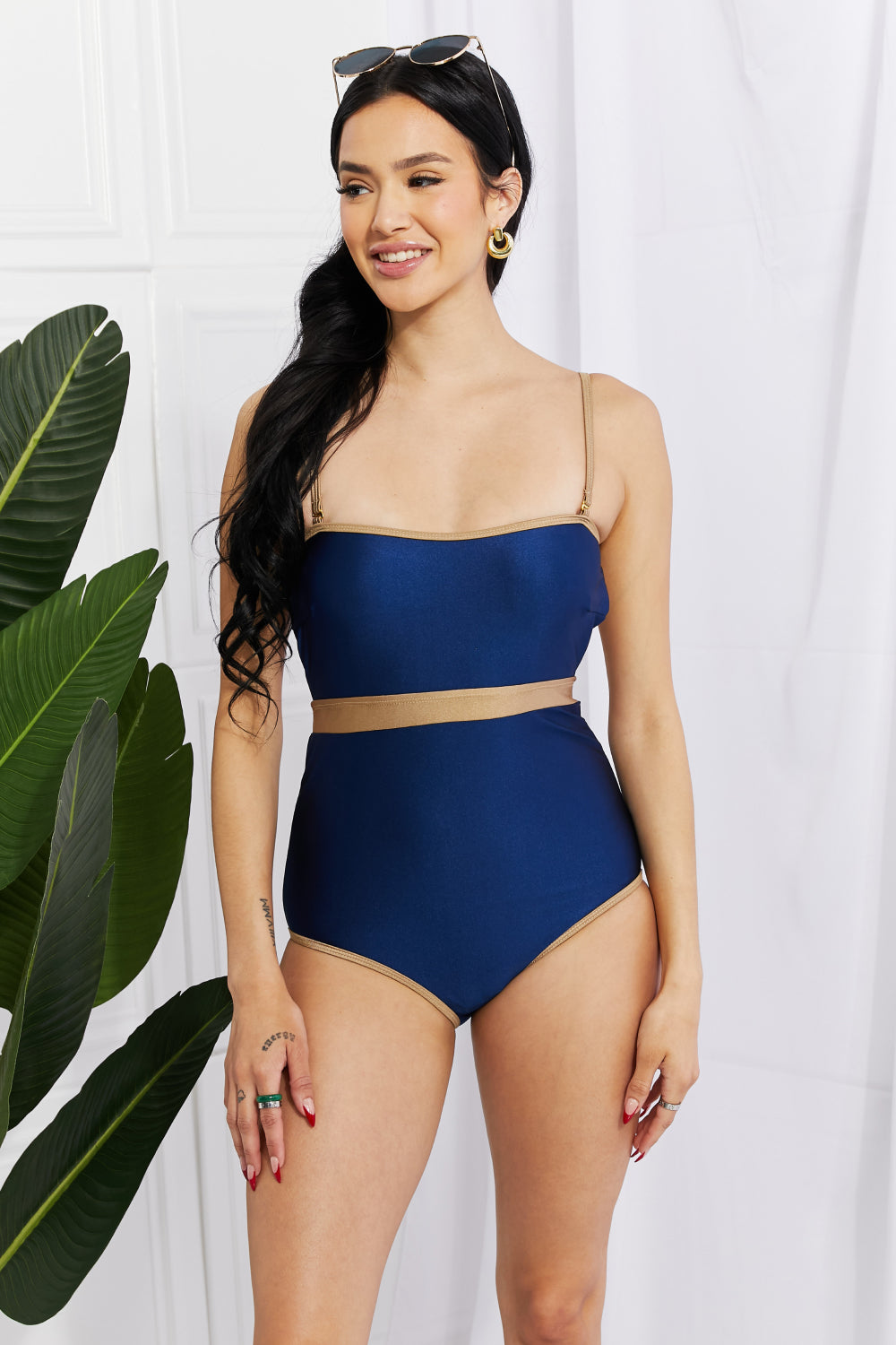 Marina West Swim Wave Break One-Piece swimsuit with contrast trim and open-back detail, showcasing a stylish design perfect for swimming.