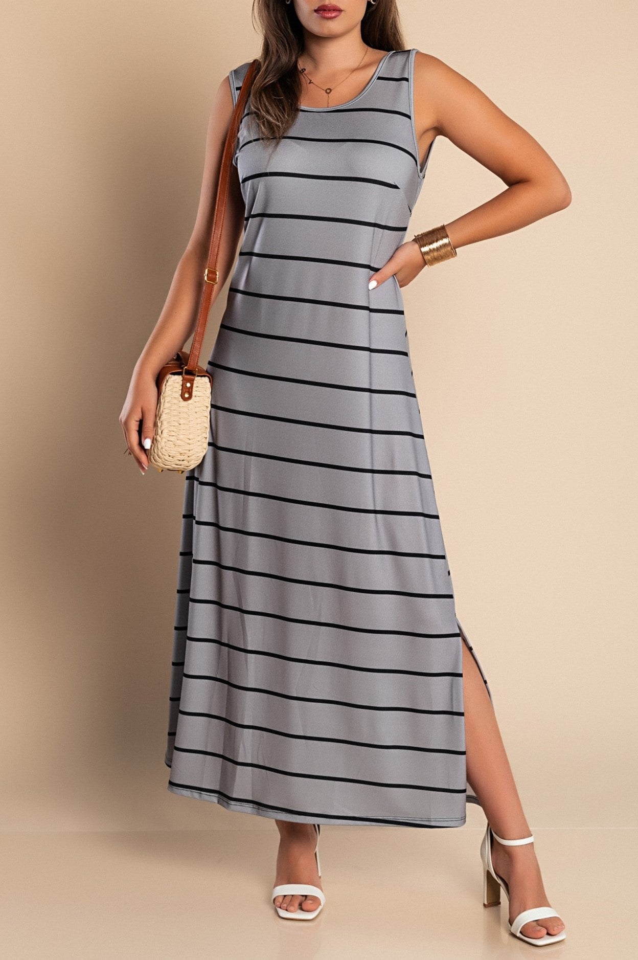 Elegant gray maxi dress with striped print, featuring a round neckline and side slit.