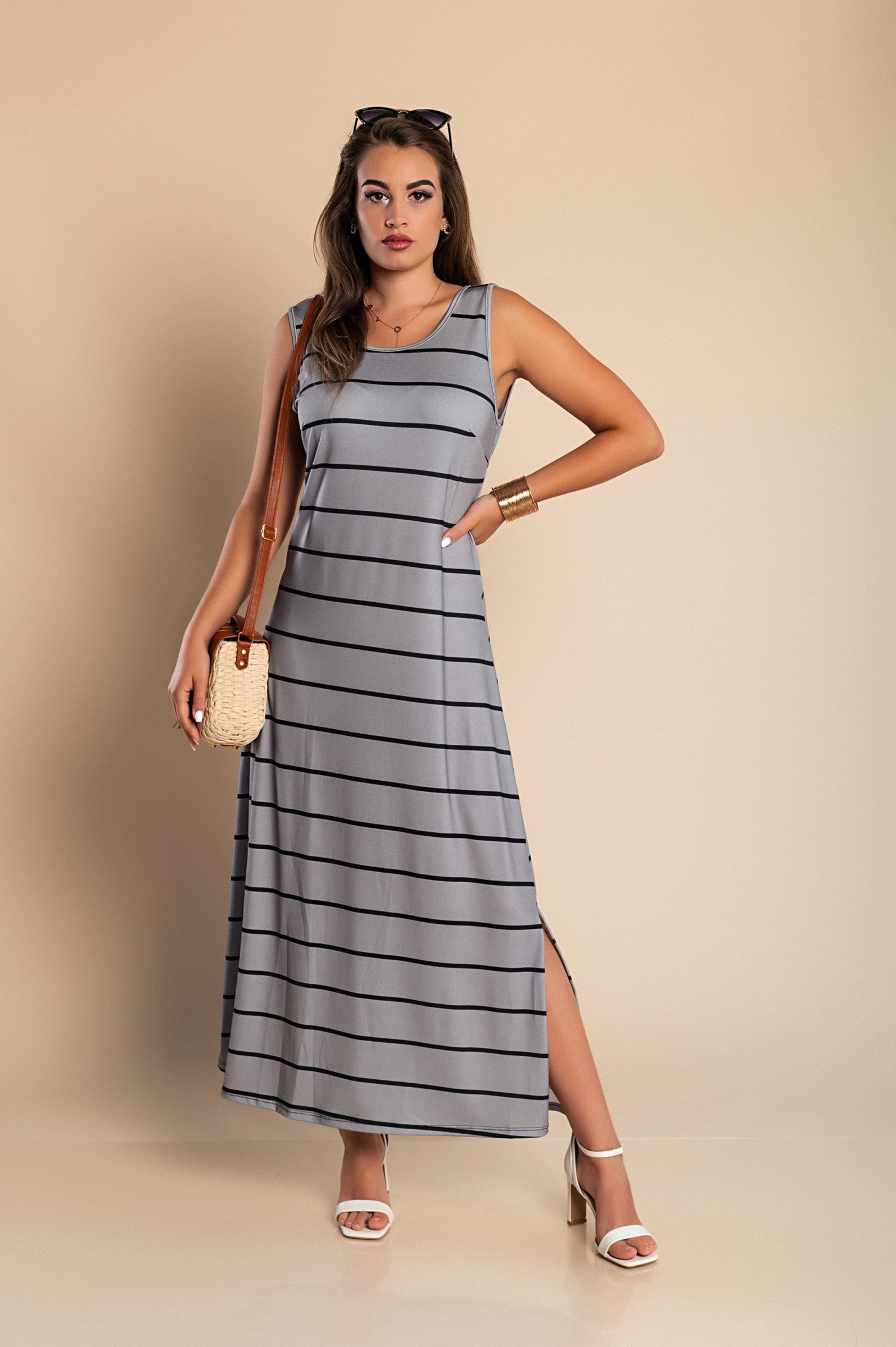 Elegant gray maxi dress with striped print, featuring a round neckline and side slit.