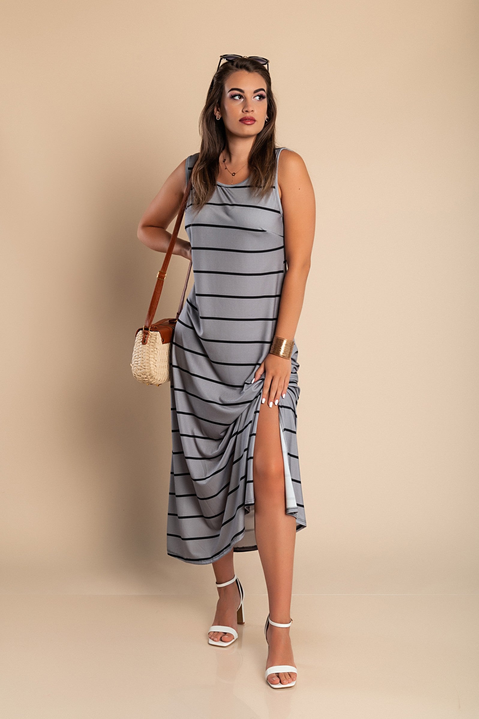 Elegant gray maxi dress with striped print, featuring a round neckline and side slit.