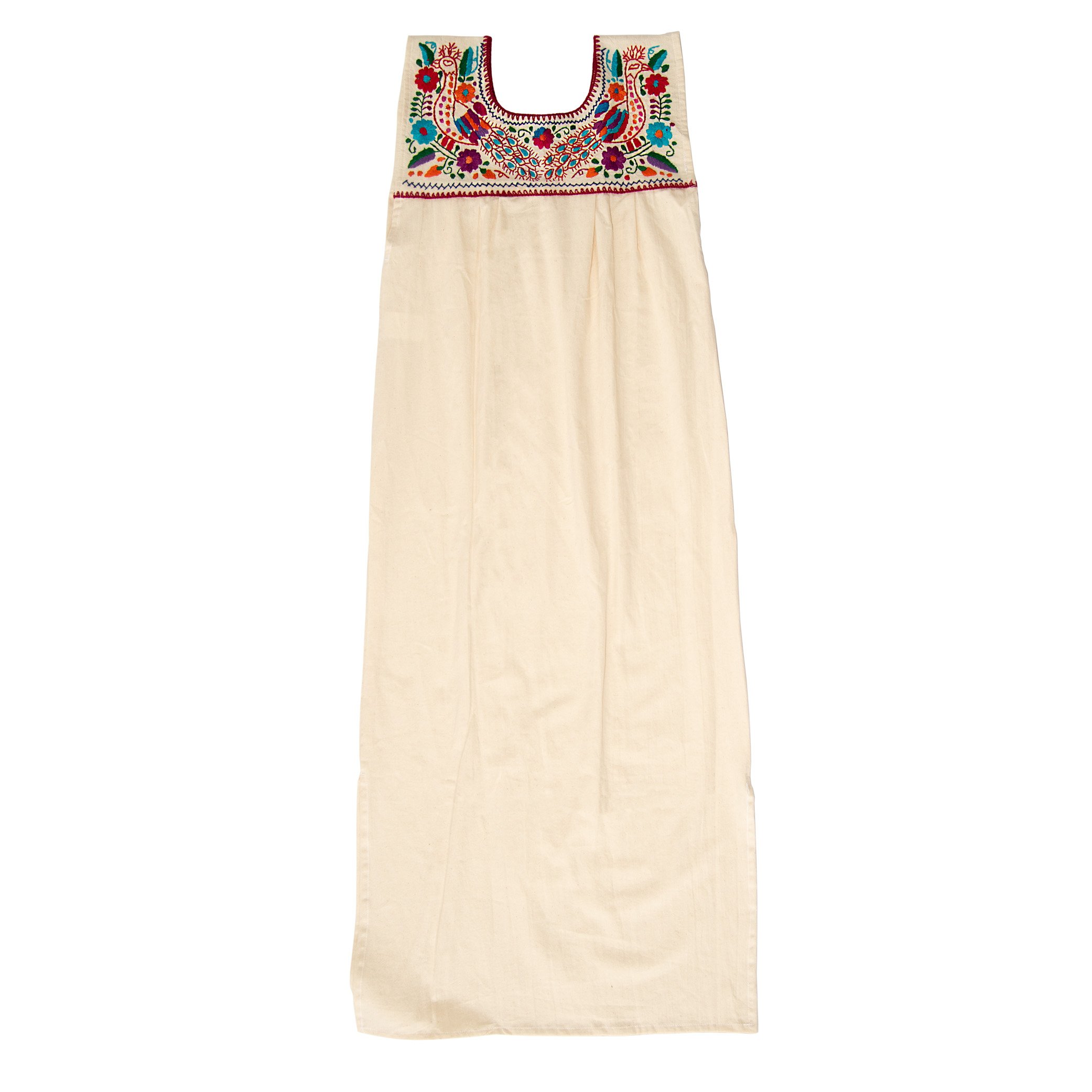 Maxi Isidra white Mexican embroidered dress featuring colorful floral designs on soft cotton fabric, showcasing artisan craftsmanship.