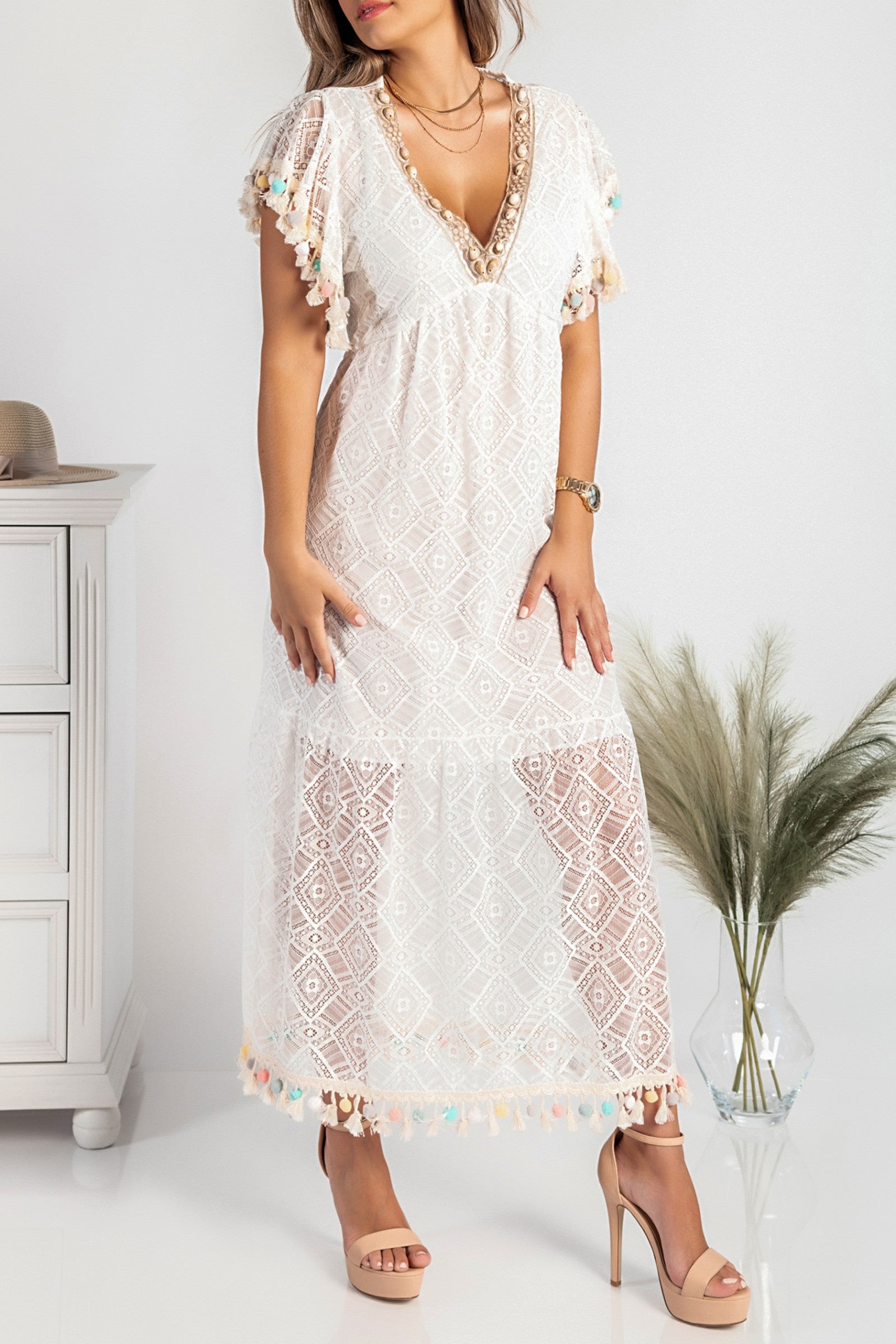 Maxi summer dress with white embroidery details, featuring a deep V neckline and short sleeves, made from lightweight cotton.