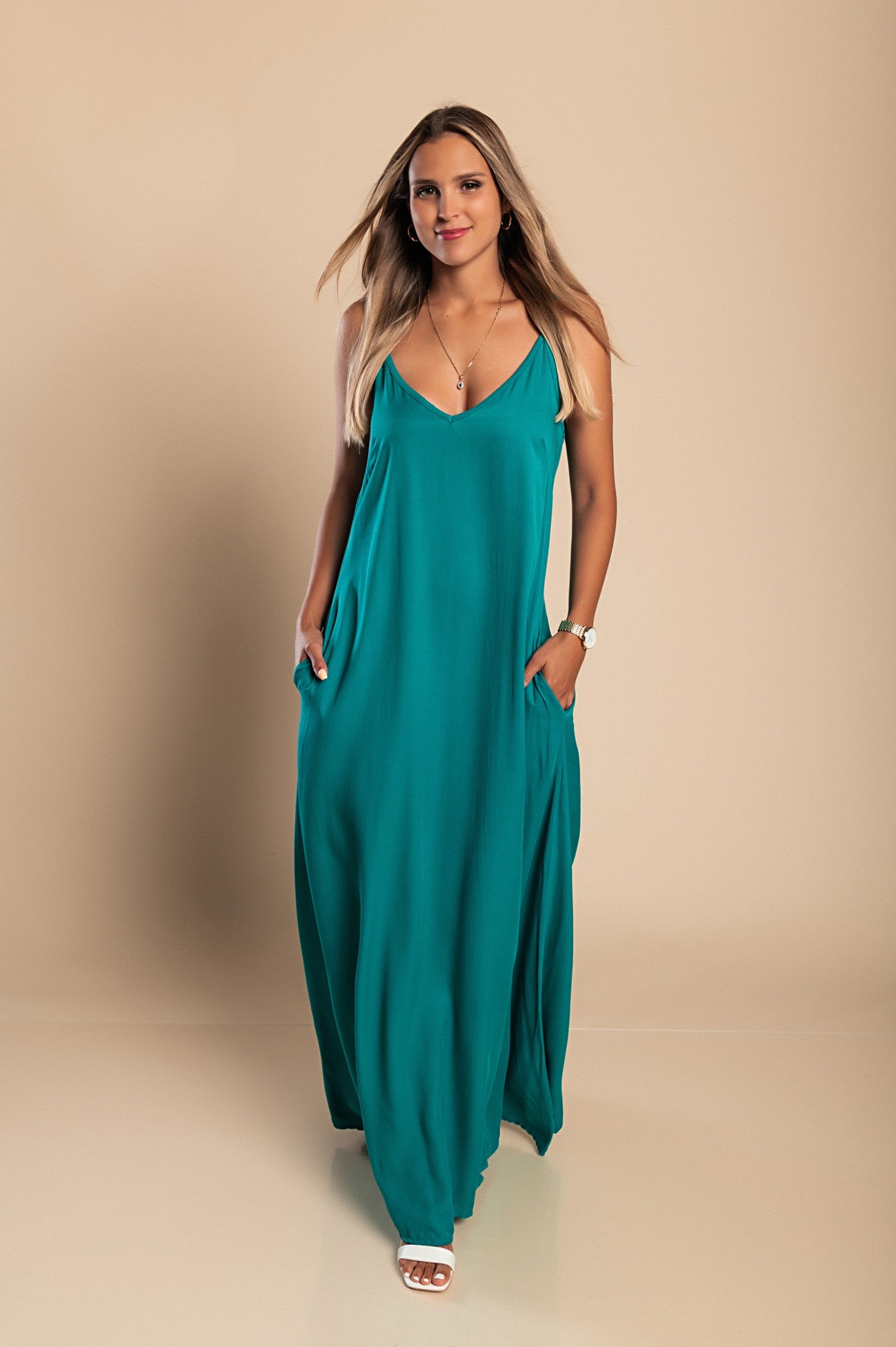 Maxi summer dress Yasmine in mint color, featuring a deep V-neckline and side pockets, made from high-quality viscose.