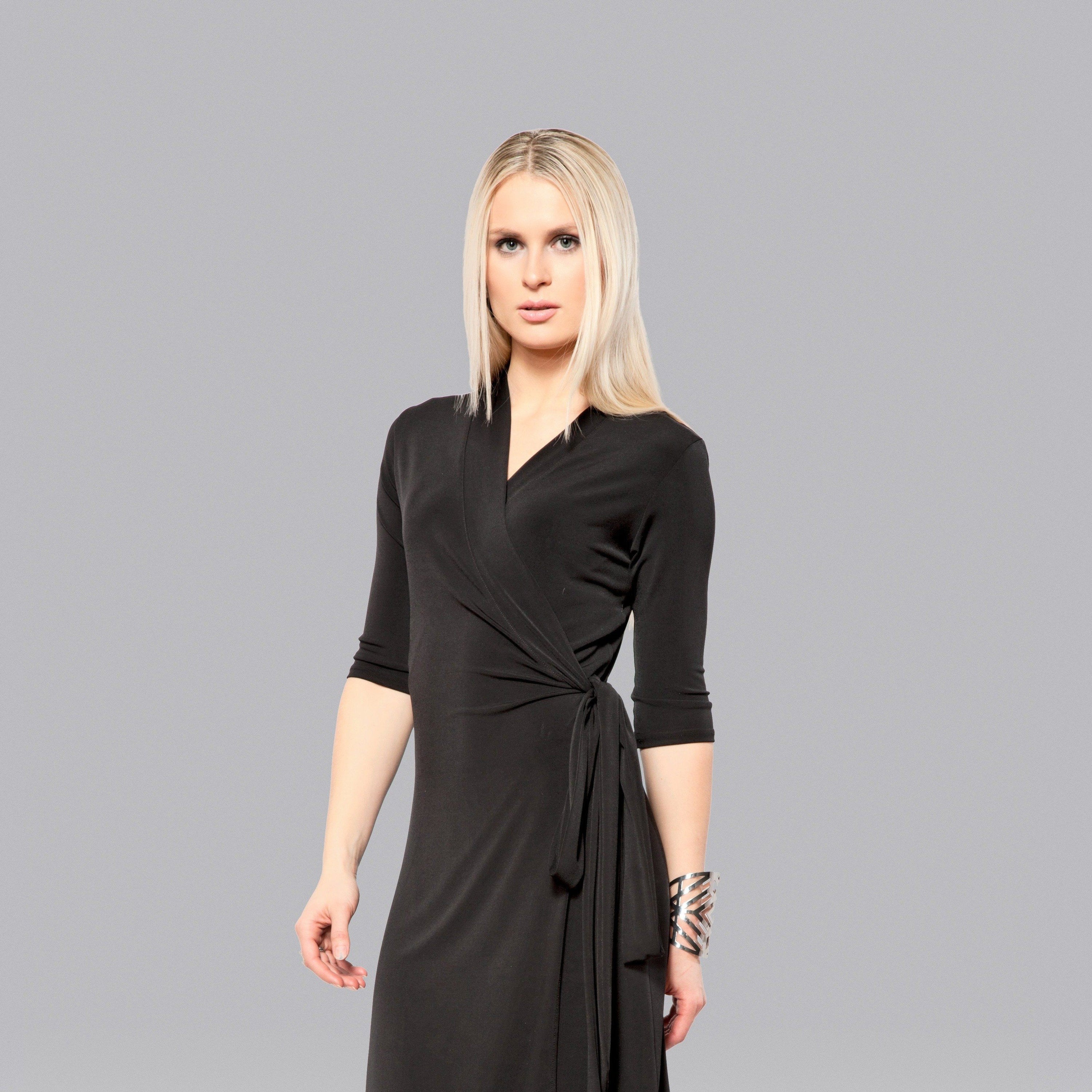 Woman in black wrap dress.