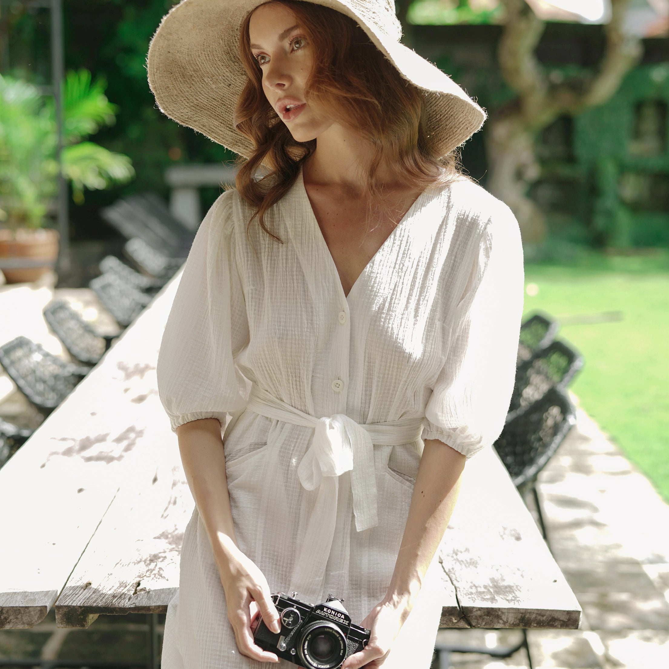 Meghan Crinkle Midi Dress in Off-White featuring V-neck, balloon sleeves, and removable belt, styled with espadrilles.