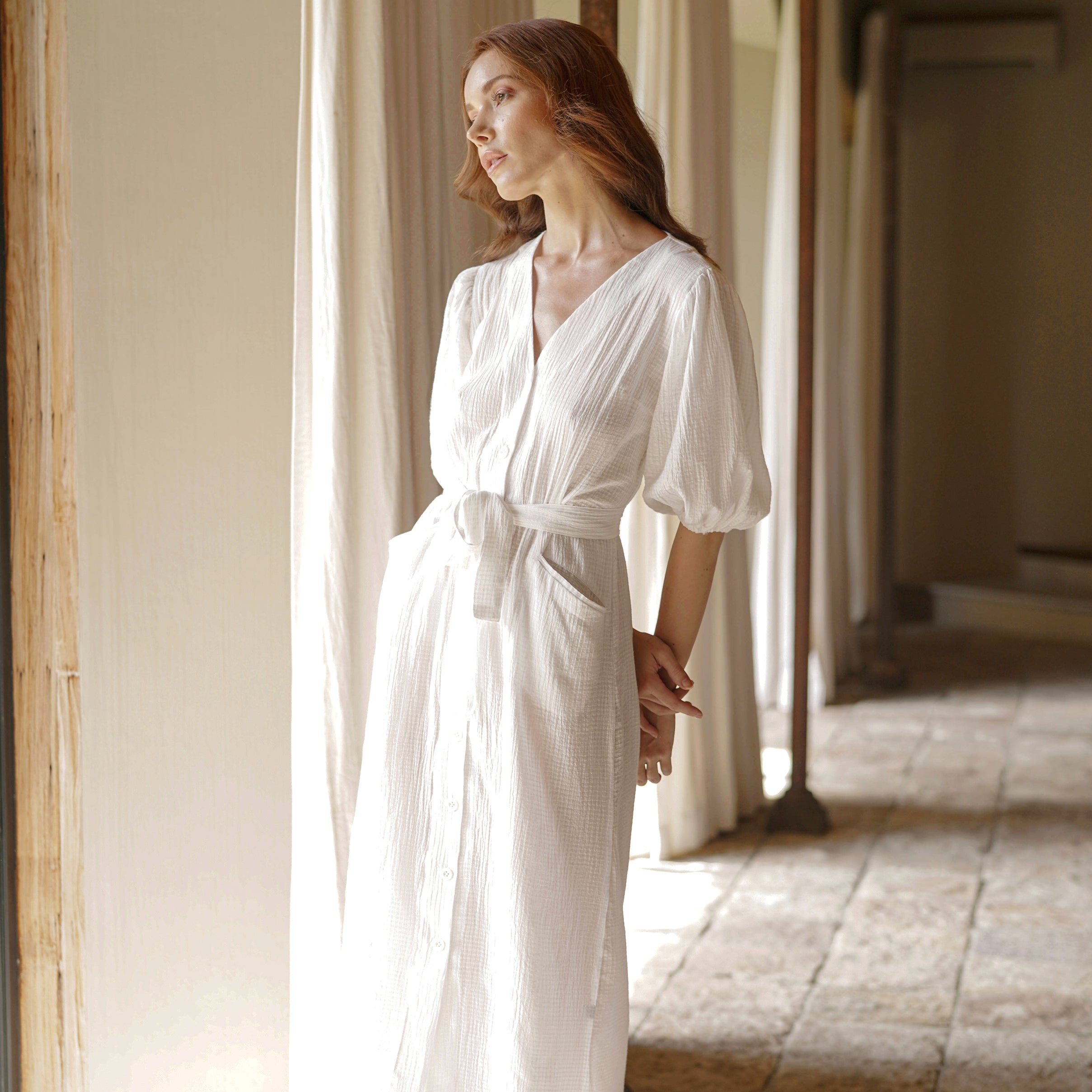 Meghan Crinkle Midi Dress in Off-White featuring V-neck, balloon sleeves, and removable belt, styled with espadrilles.