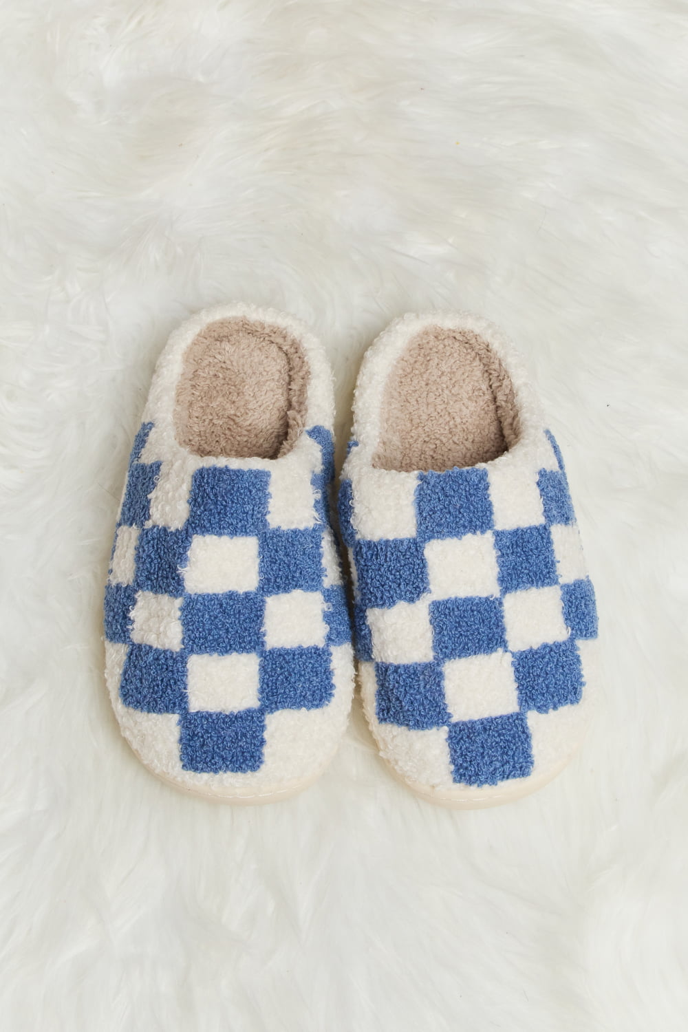 Melody Checkered Print Plush Slide Slippers featuring a cozy faux fur top and durable rubber sole, designed for stylish indoor comfort.