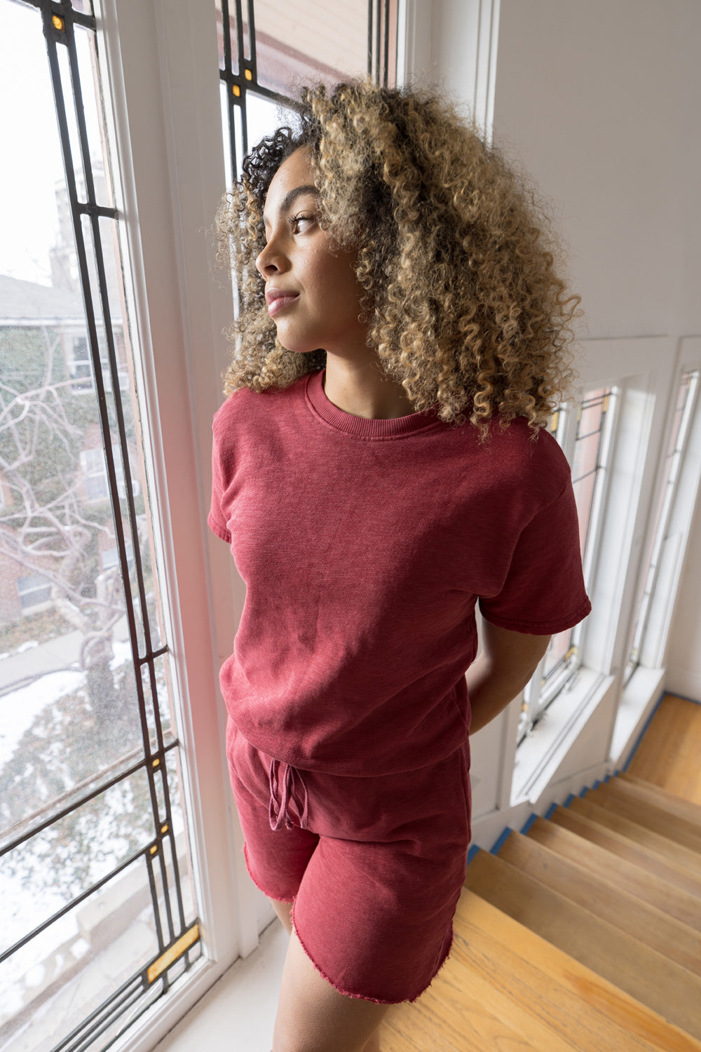 Melody Shorts in various colors including Washed Black, Sky Blue, Lime, and Maroon, featuring a drawstring waist and raw hem detail.