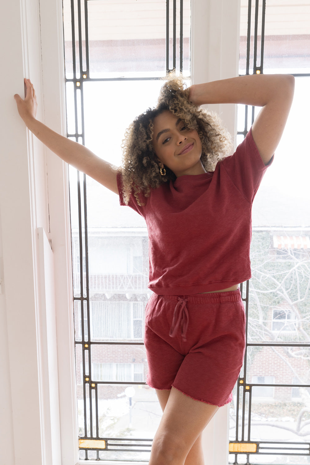 Melody Shorts in various colors including Washed Black, Sky Blue, Lime, and Maroon, featuring a drawstring waist and raw hem detail.