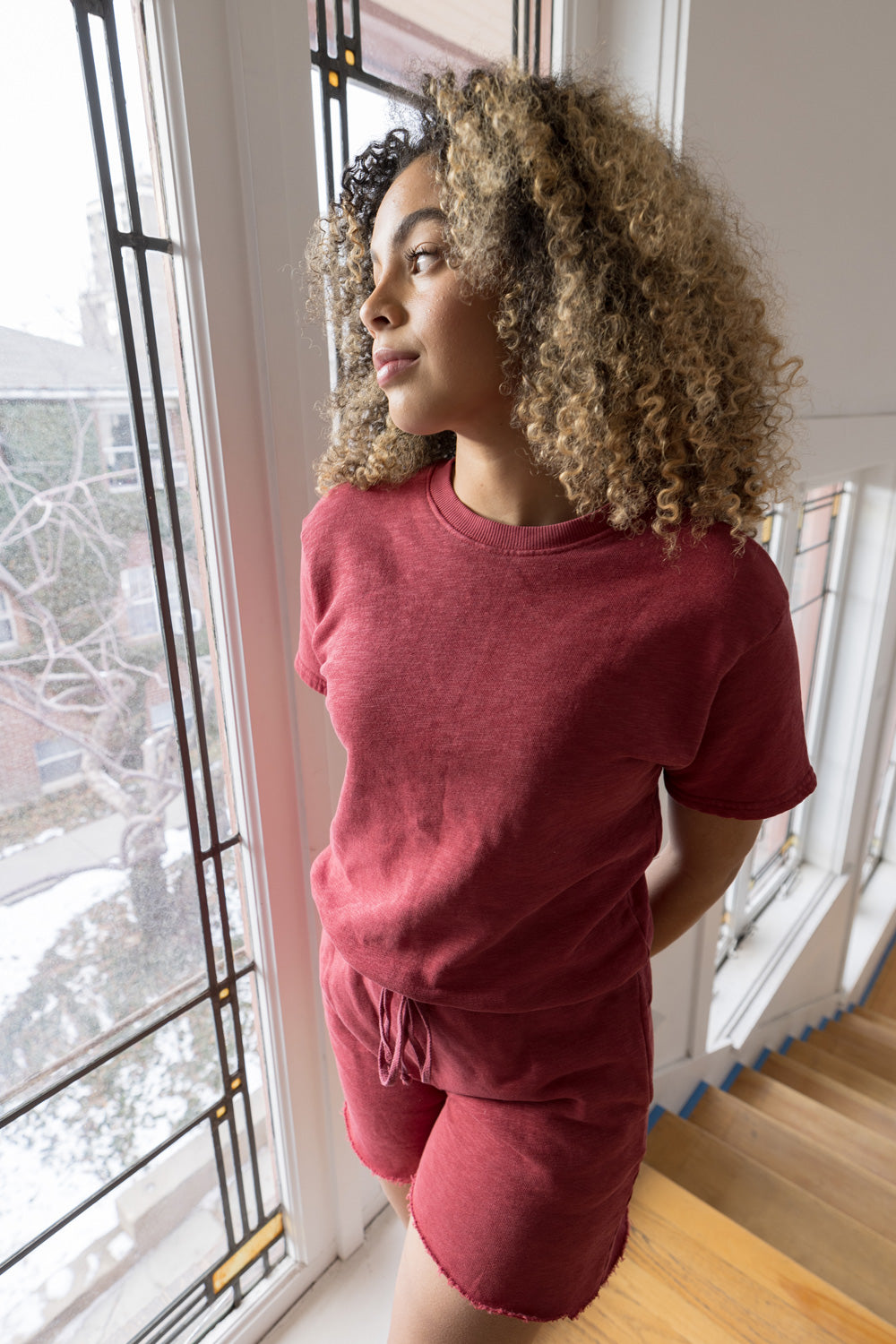 Melody Shorts in various colors including Washed Black, Sky Blue, Lime, and Maroon, featuring a drawstring waist and raw hem detail.