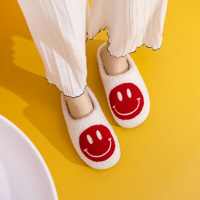 Melody Smiley Face Cozy Slippers featuring a plush faux fur top and a cheerful smiley face design, perfect for indoor comfort.