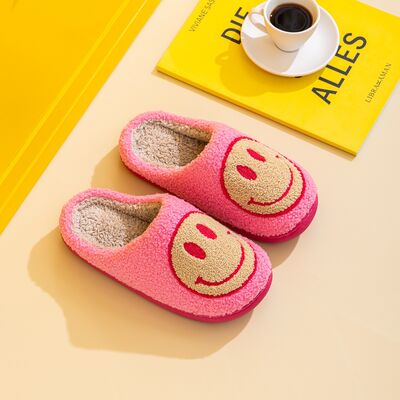 Melody Smiley Face Slippers featuring a cute smiley face design, soft faux fur top, and durable rubber sole, perfect for cozy home wear.