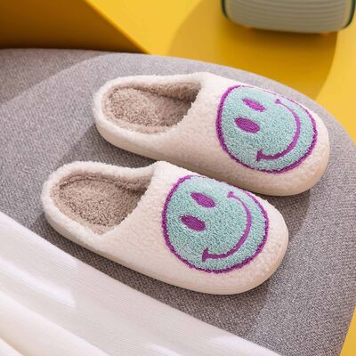 Cozy Melody Smiley Face Slippers with plush faux fur and rubber sole, featuring a cheerful smiley face design.