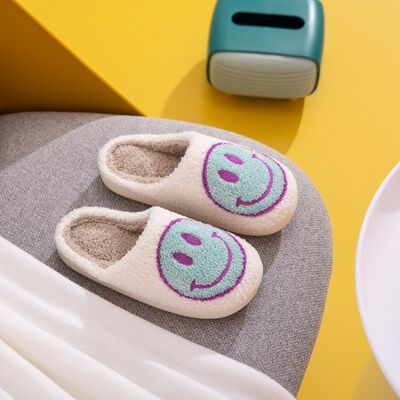 Cozy Melody Smiley Face Slippers with plush faux fur and rubber sole, featuring a cheerful smiley face design.