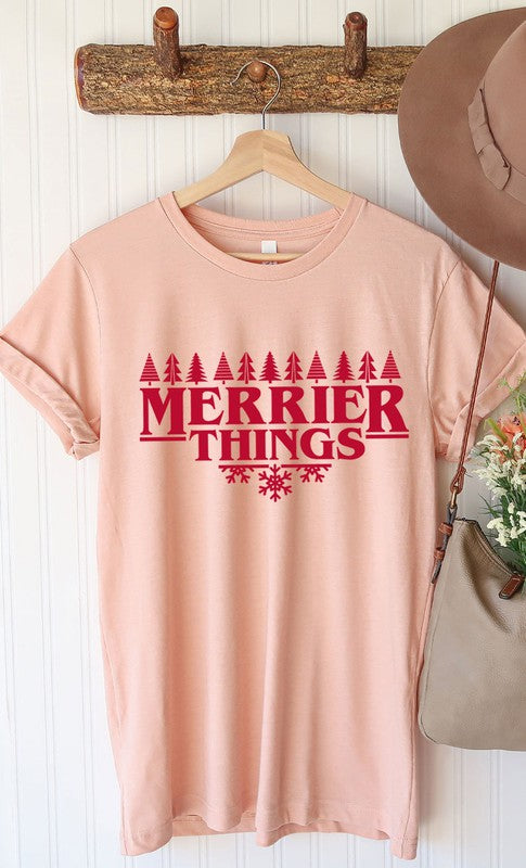 Merrier Things Festive Christmas PLUS Graphic Tee featuring a colorful holiday graphic design on a soft cotton blend fabric.