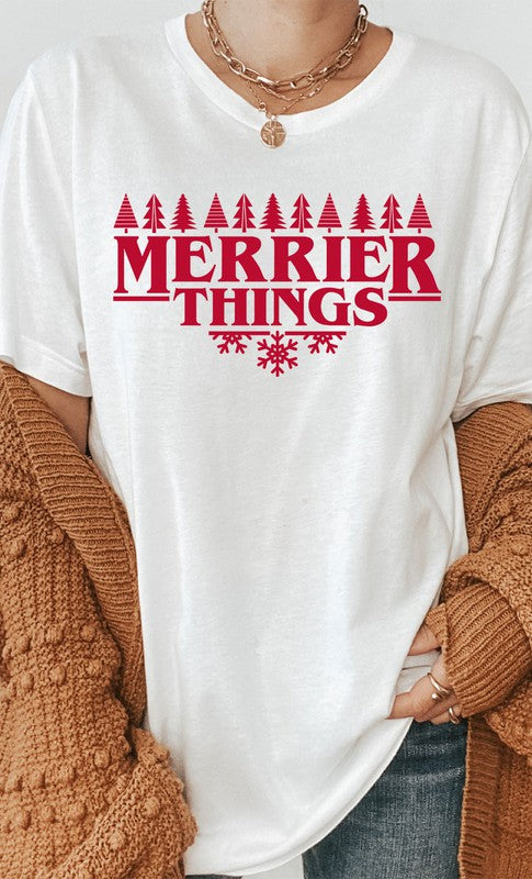 Merrier Things Festive Christmas PLUS Graphic Tee featuring a colorful holiday graphic design on a soft cotton blend fabric.