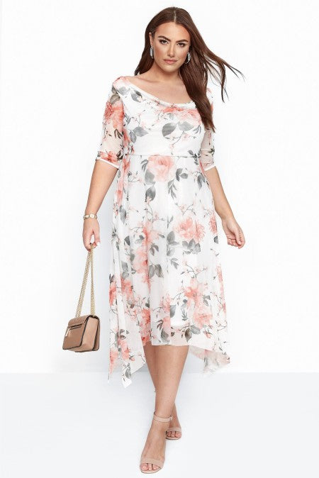 A stylish midi dress featuring short sleeves, a floral pattern, and a loose skirt, perfect for summer occasions.