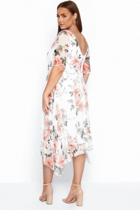 A stylish midi dress featuring short sleeves, a floral pattern, and a loose skirt, perfect for summer occasions.