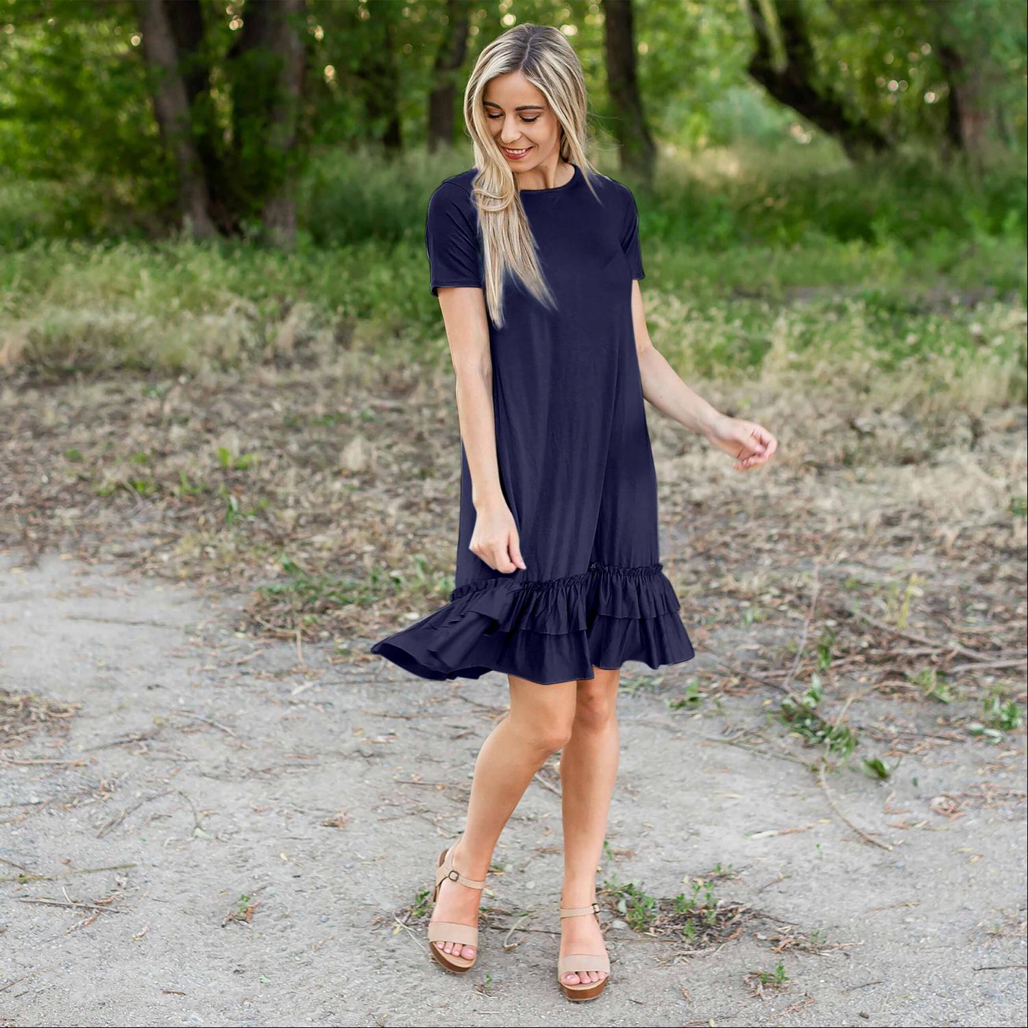 A stylish midi dress featuring short sleeves, cute pocket embellishments, and a ruffled hemline, perfect for any occasion.