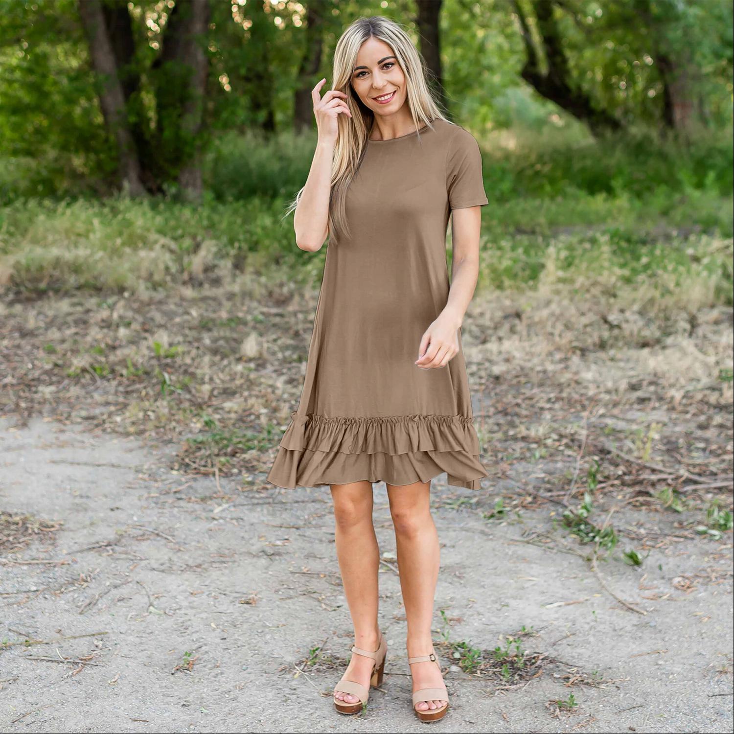 A stylish midi dress featuring short sleeves, cute pocket embellishments, and a ruffled hemline, perfect for any occasion.