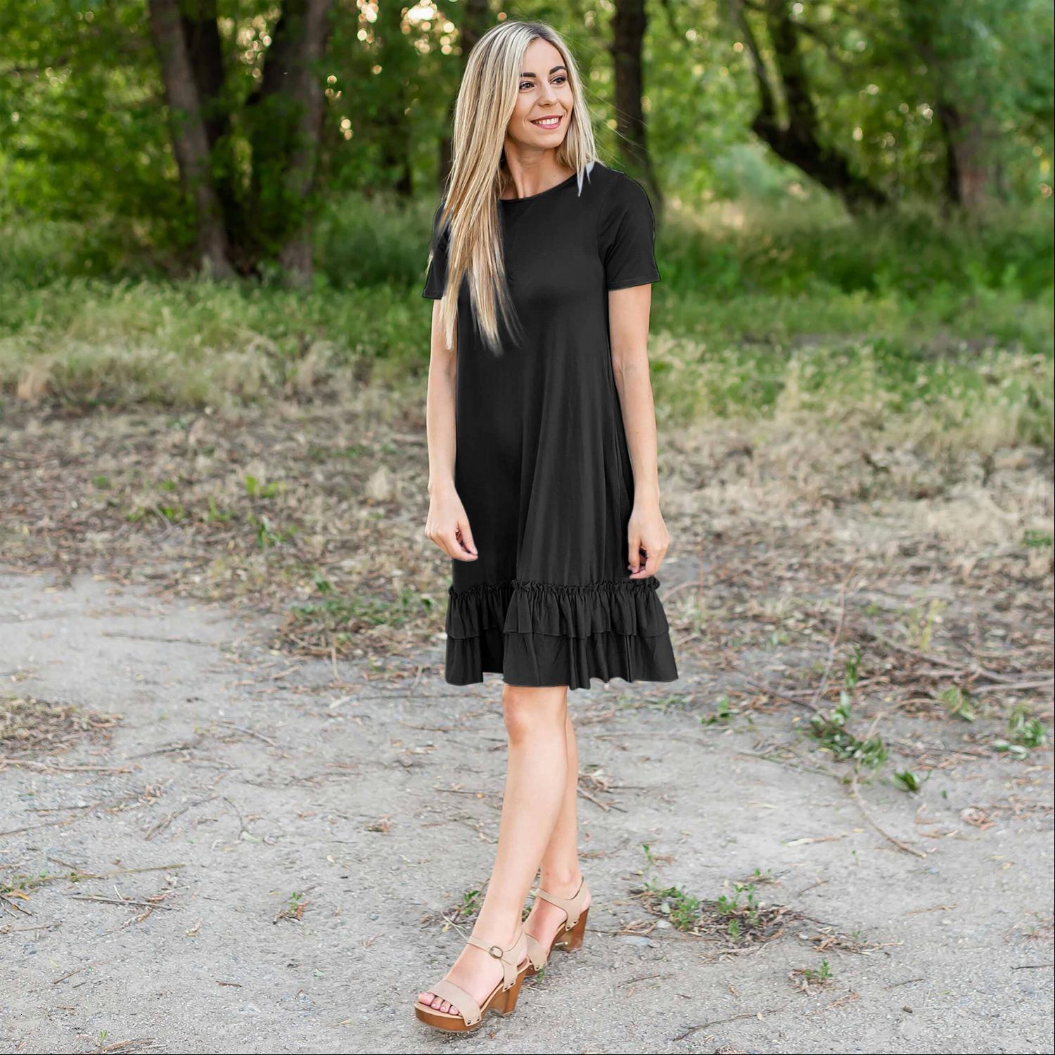 A stylish midi dress featuring short sleeves, cute pocket embellishments, and a ruffled hemline, perfect for any occasion.