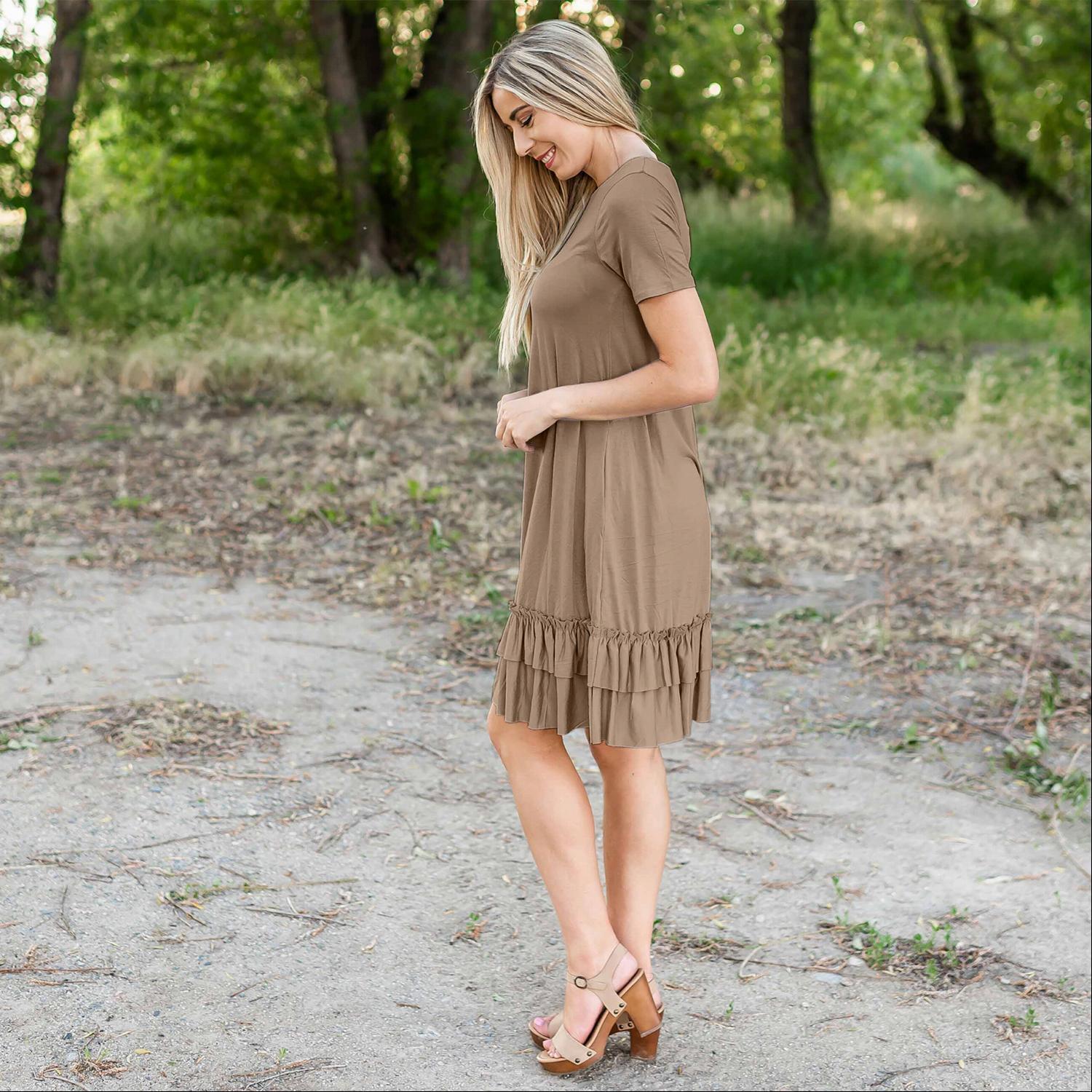 A stylish midi dress featuring short sleeves, cute pocket embellishments, and a ruffled hemline, perfect for any occasion.