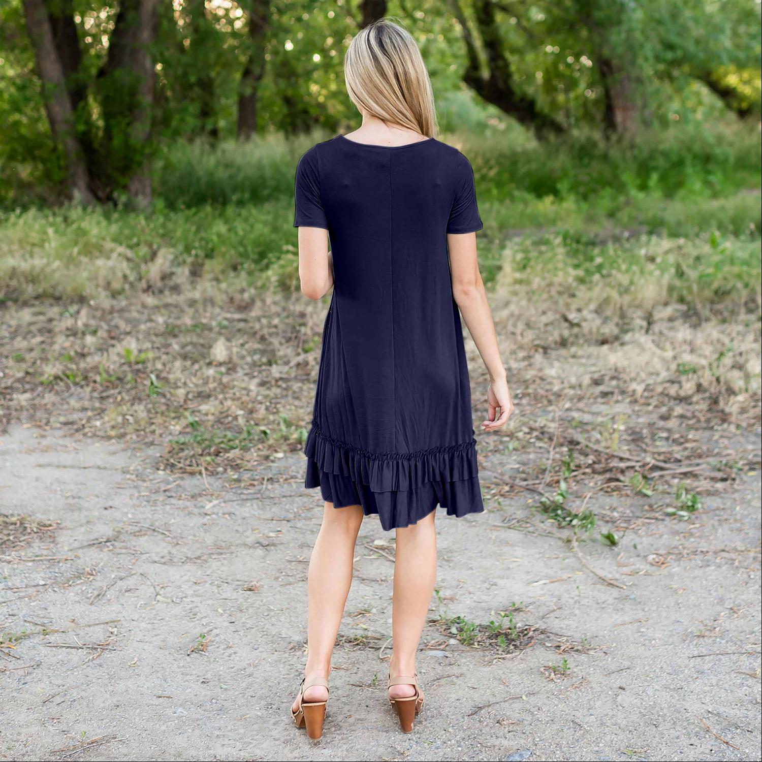 A stylish midi dress featuring short sleeves, cute pocket embellishments, and a ruffled hemline, perfect for any occasion.