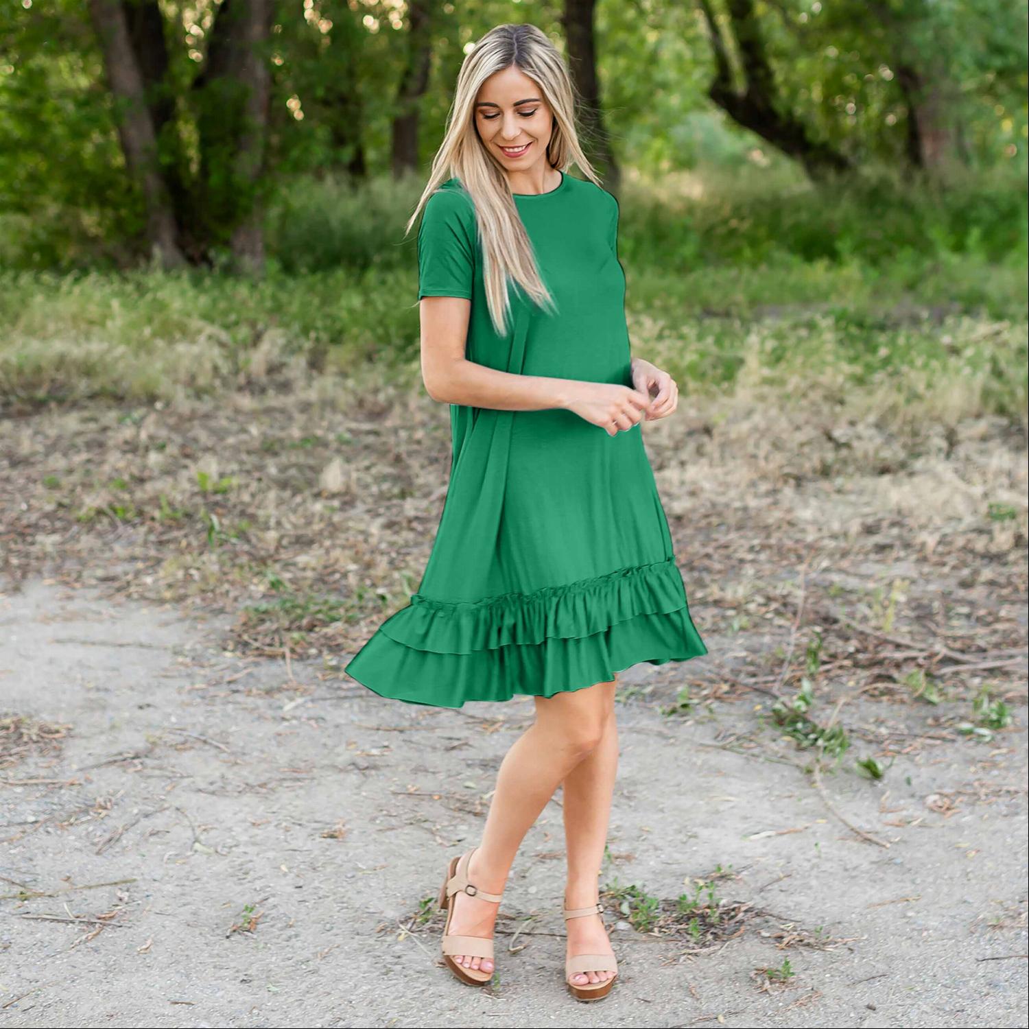 A stylish midi dress featuring short sleeves, cute pocket embellishments, and a ruffled hemline, perfect for any occasion.