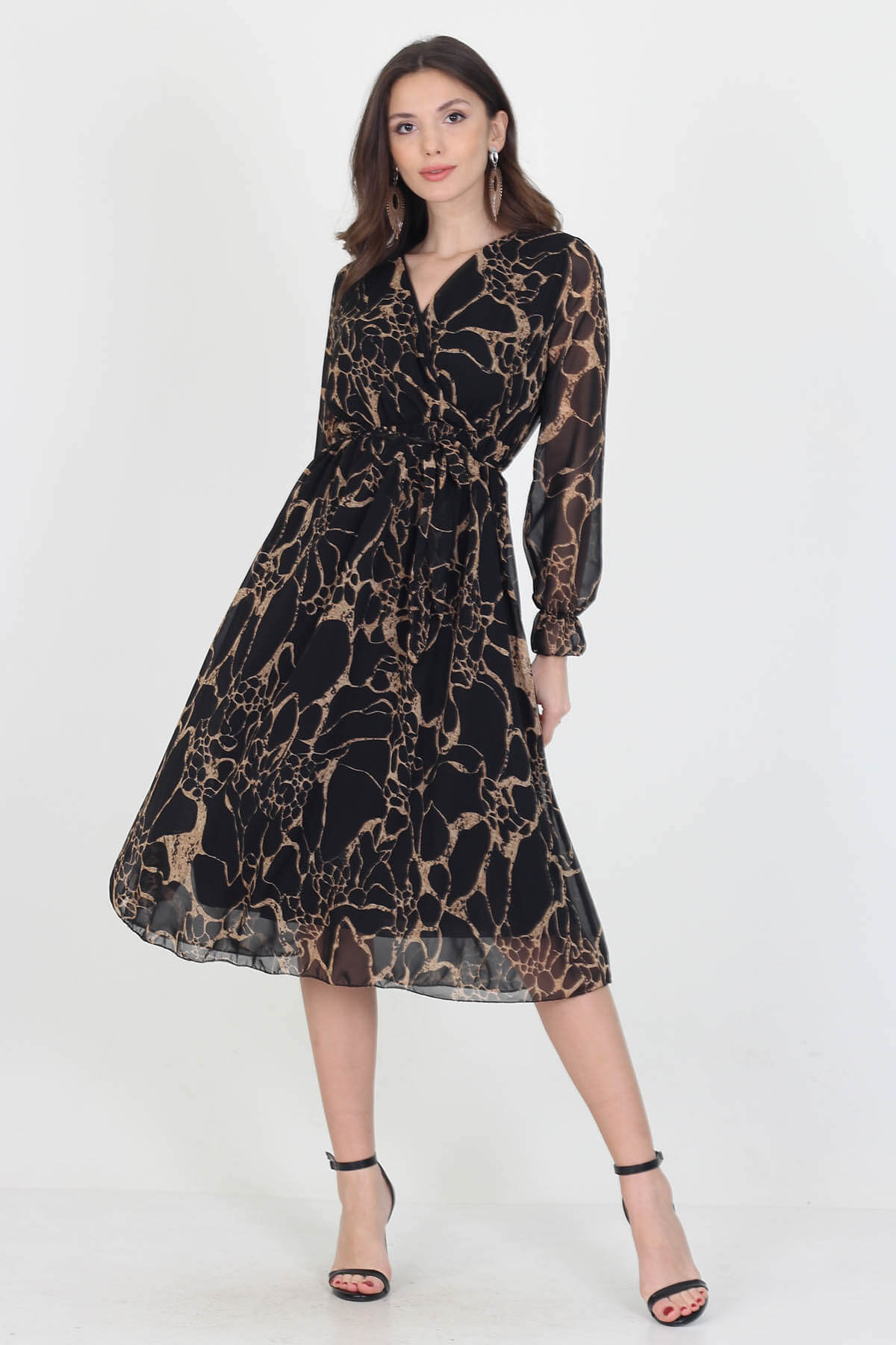 A stylish midi length chiffon dress with a self-tie belt, showcasing its elegant design and lightweight fabric.