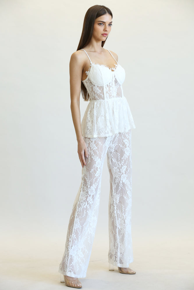 Milania Peplum Waist Jumpsuit featuring stretch lace fabric, scallop lace bustline, and adjustable shoulder straps.