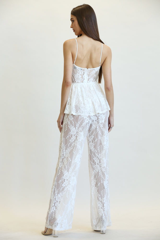 Milania Peplum Waist Jumpsuit featuring stretch lace fabric, scallop lace bustline, and adjustable shoulder straps.