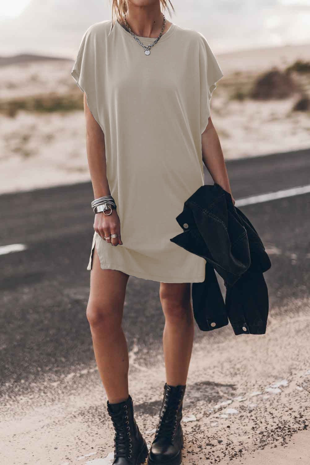 Beige mini dress with loose sleeves and round neckline, showcasing a comfortable and stylish design.