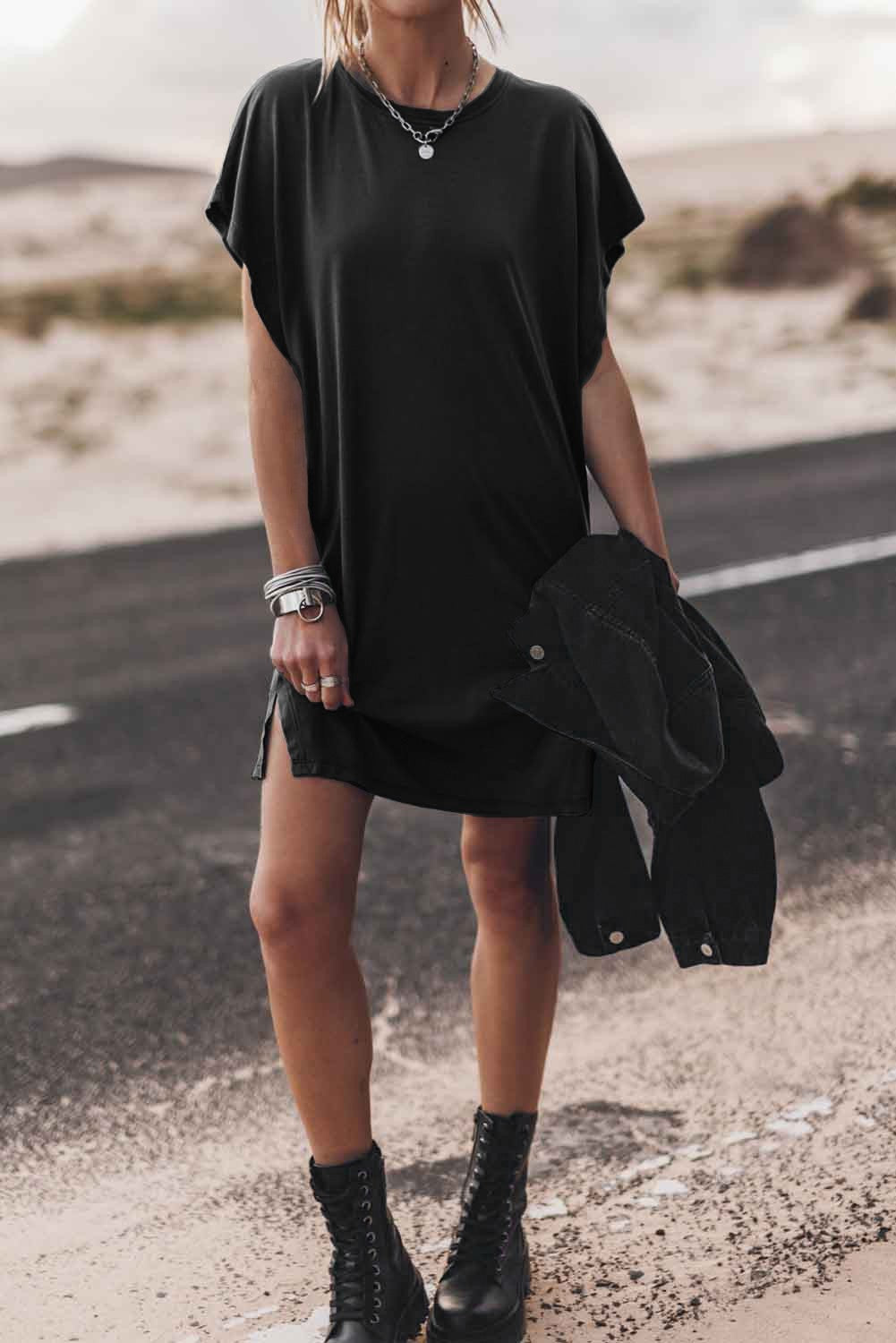 A stylish black mini dress featuring loose sleeves and a round neckline, designed for comfort and elegance.