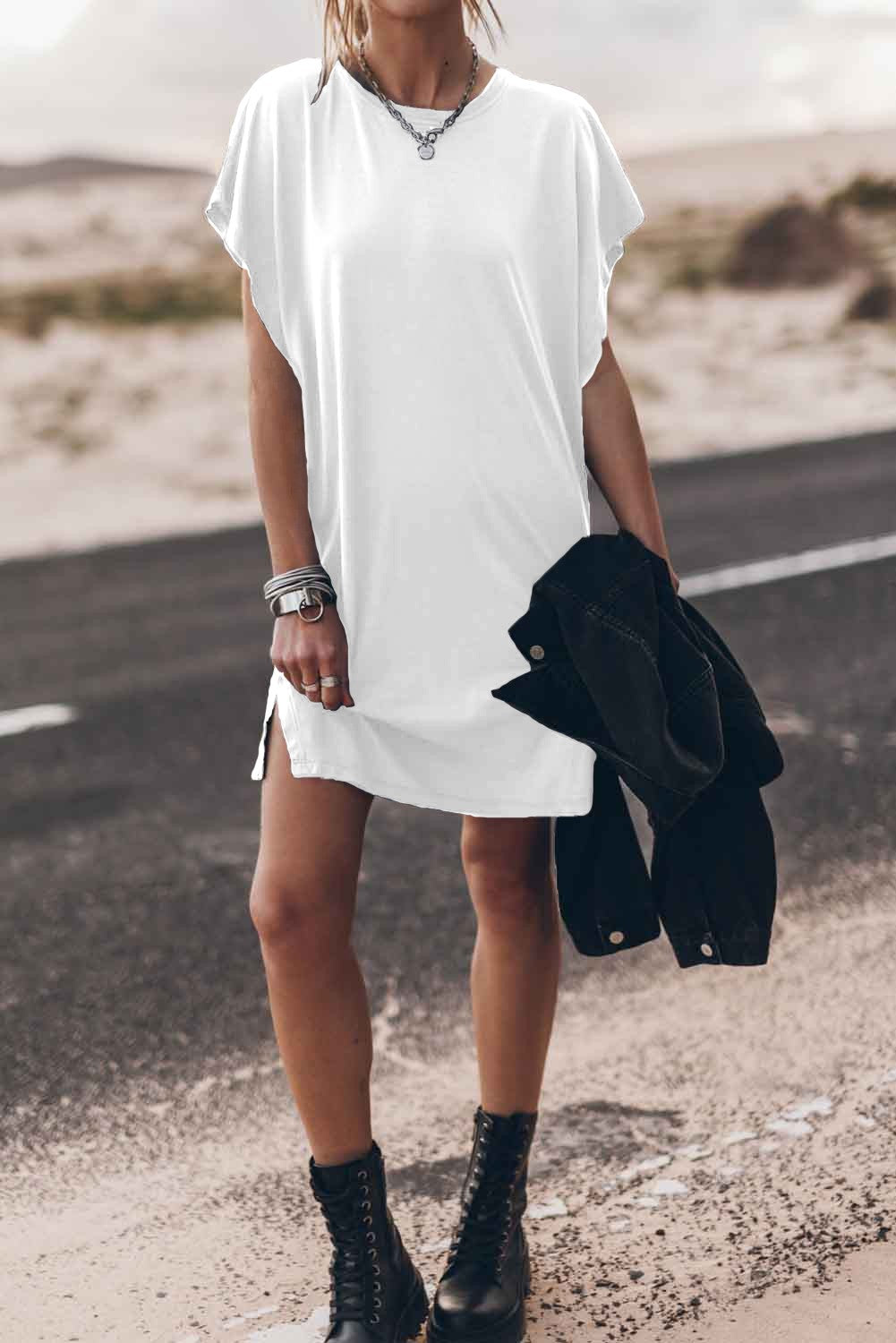 White mini dress with loose sleeves and round neckline, made from high-quality cotton blend fabric.