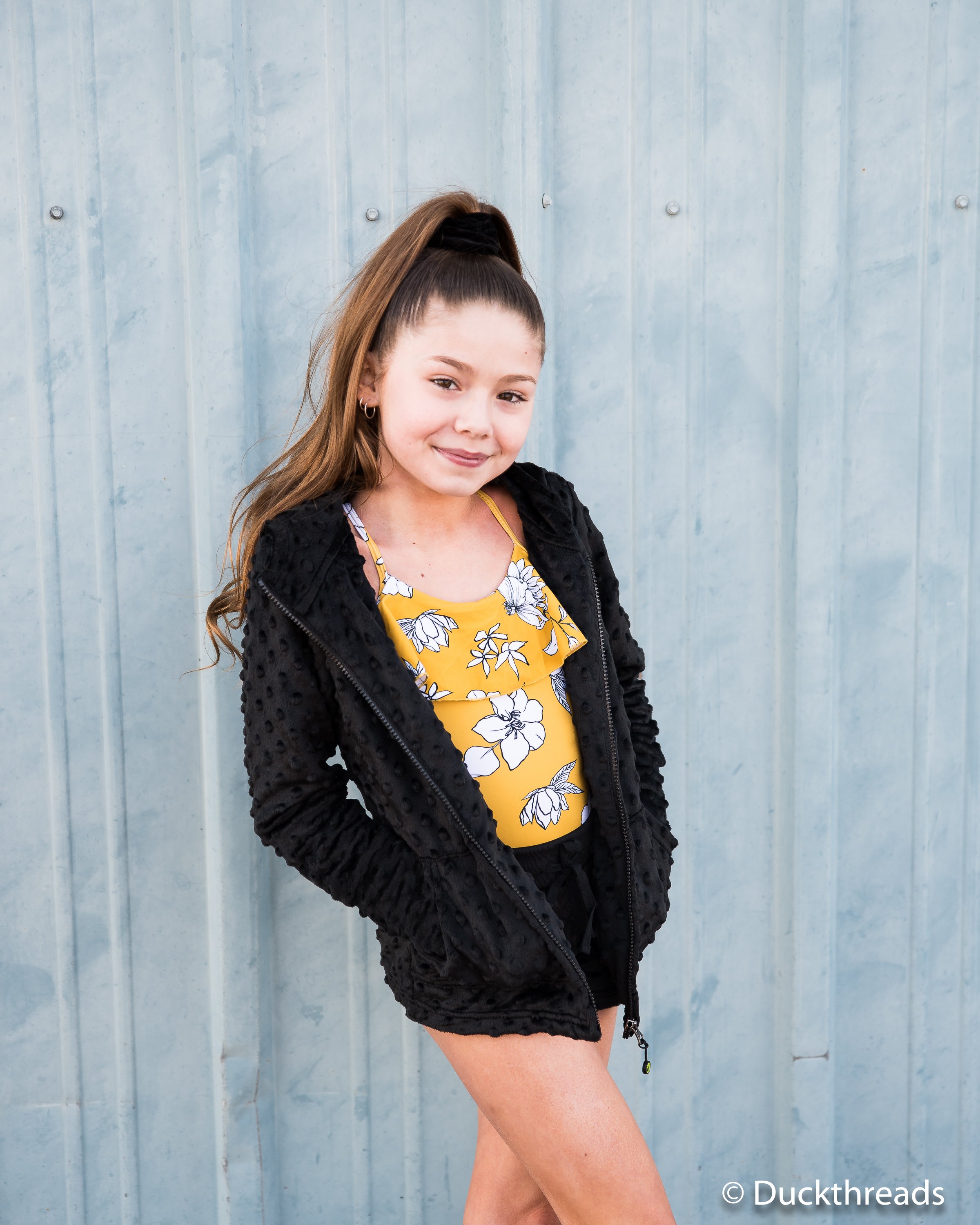 A stylish black Minky Bubble Hoodie featuring a soft texture, thumbholes, and a relaxed fit, perfect for layering and comfort.