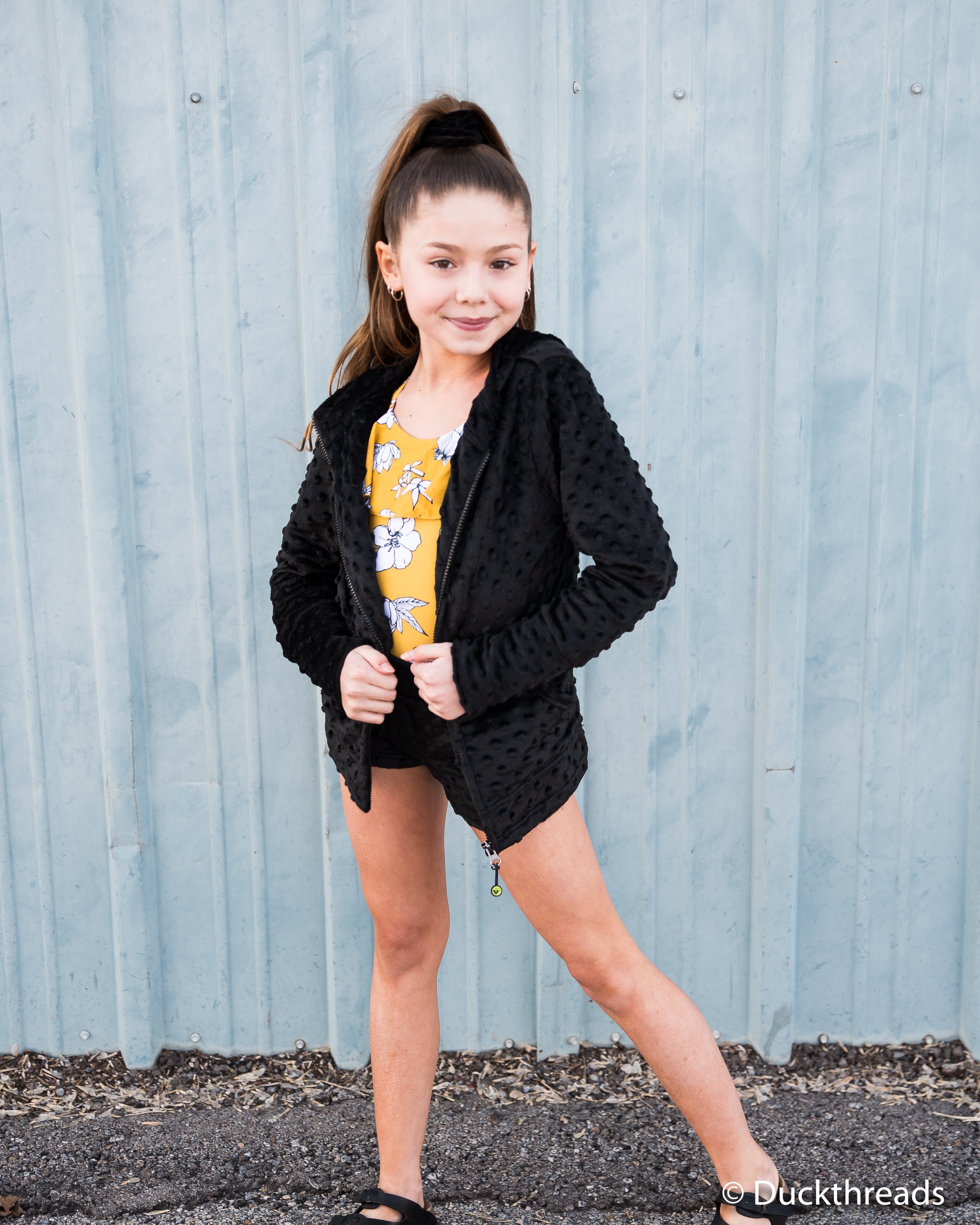 A stylish black Minky Bubble Hoodie featuring a soft texture, thumbholes, and a relaxed fit, perfect for layering and comfort.