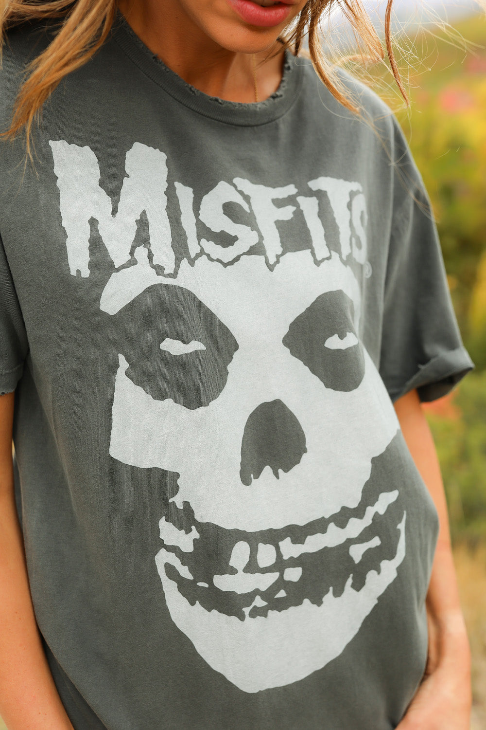 Misfits Distressed Sunkissed Tee in vintage wash black with distressed edges, showcasing a punk style and made from 100% organic cotton.